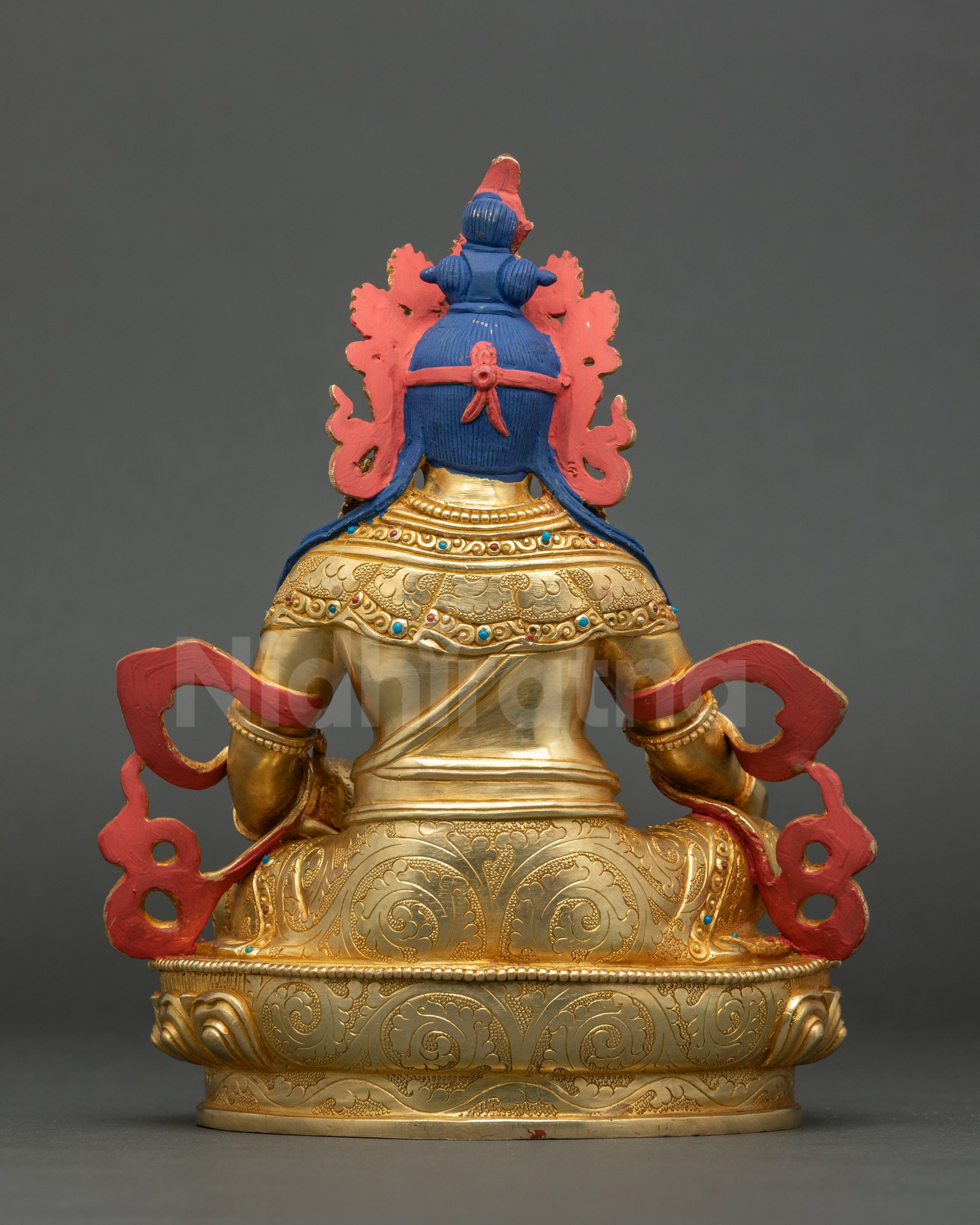Dzambhala statue seated on lotus throne, gold-gilded Himalayan Buddhist sculpture