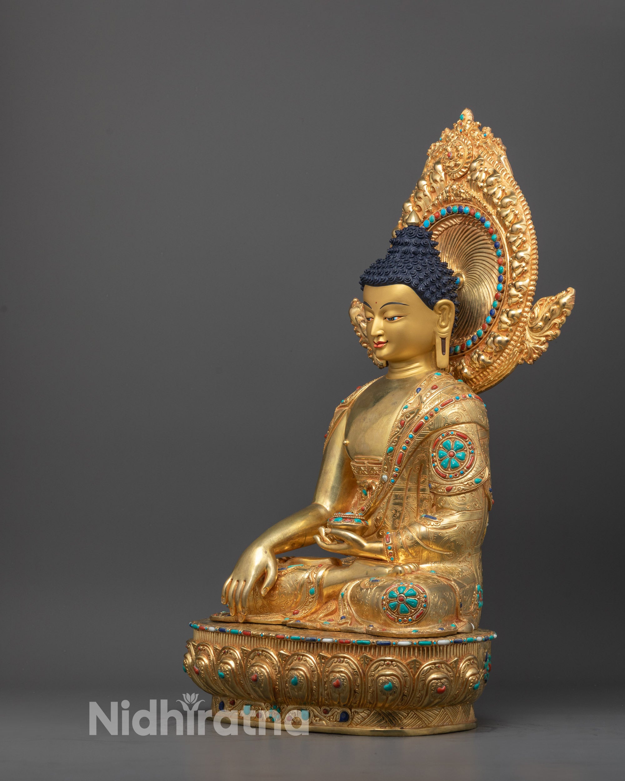 Elegant Shakyamuni Buddha statue with radiant 24k gold finish seated in meditation