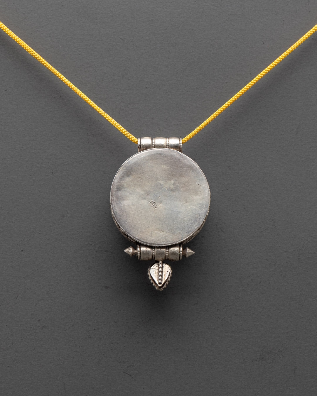 Elegant handmade silver Lotus Locket with filigree design, side profile view
