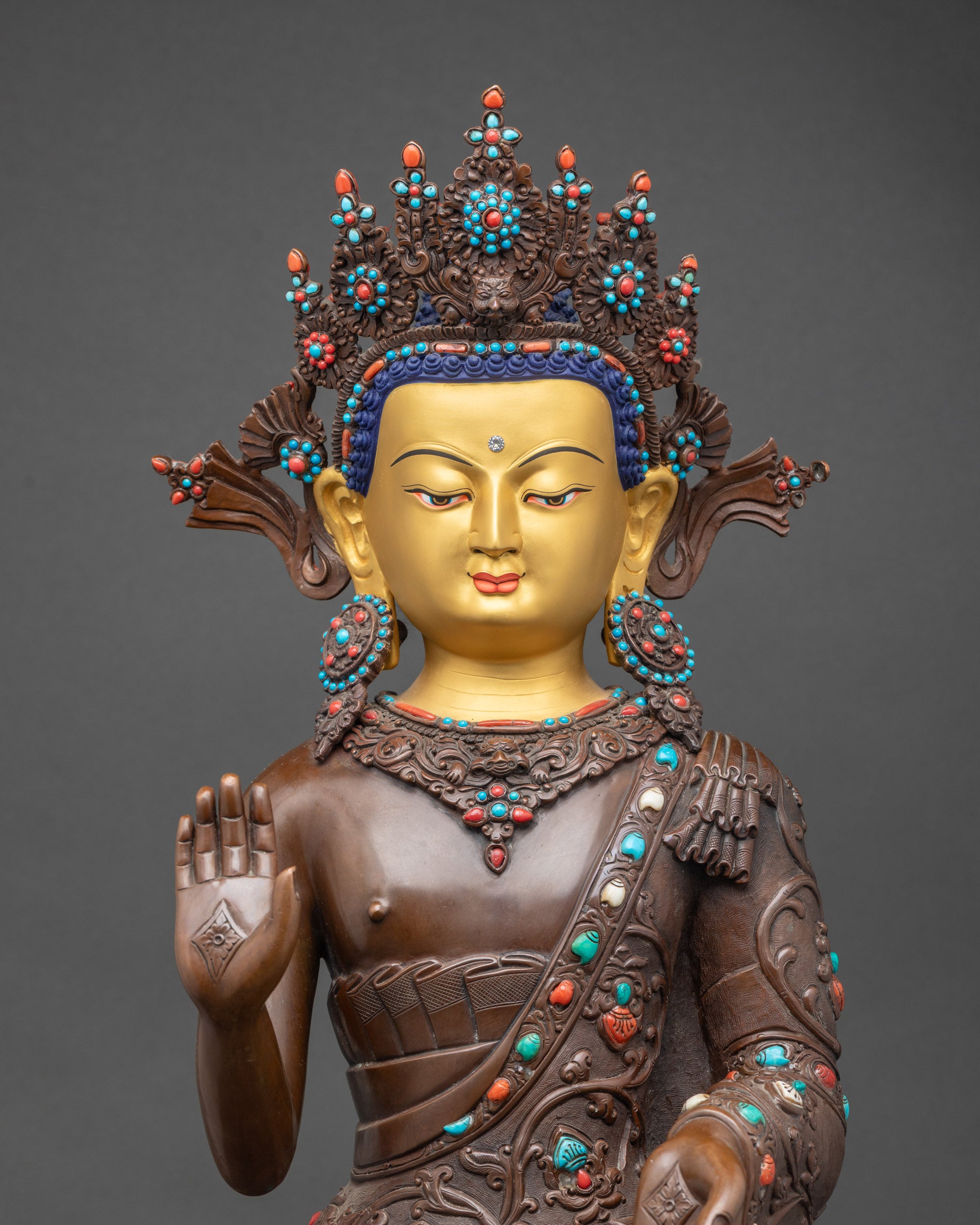 Close-up Dipankara Buddha face calm golden expression, hand-painted halo detailing