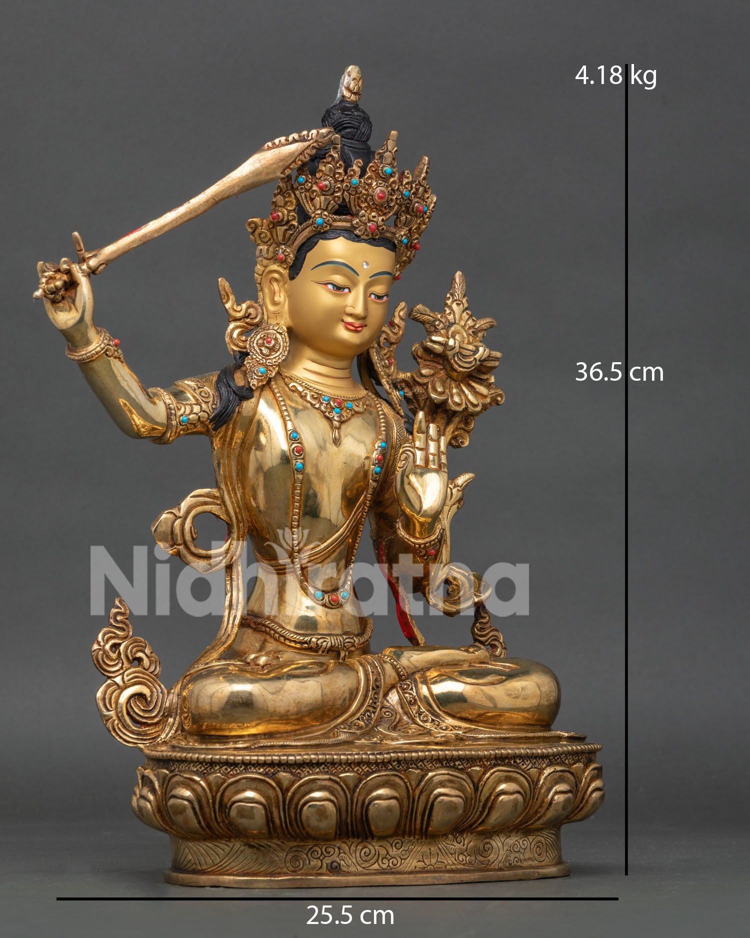 Right profile of Manjushri statue with flaming wisdom sword and traditional Nepalese artistry