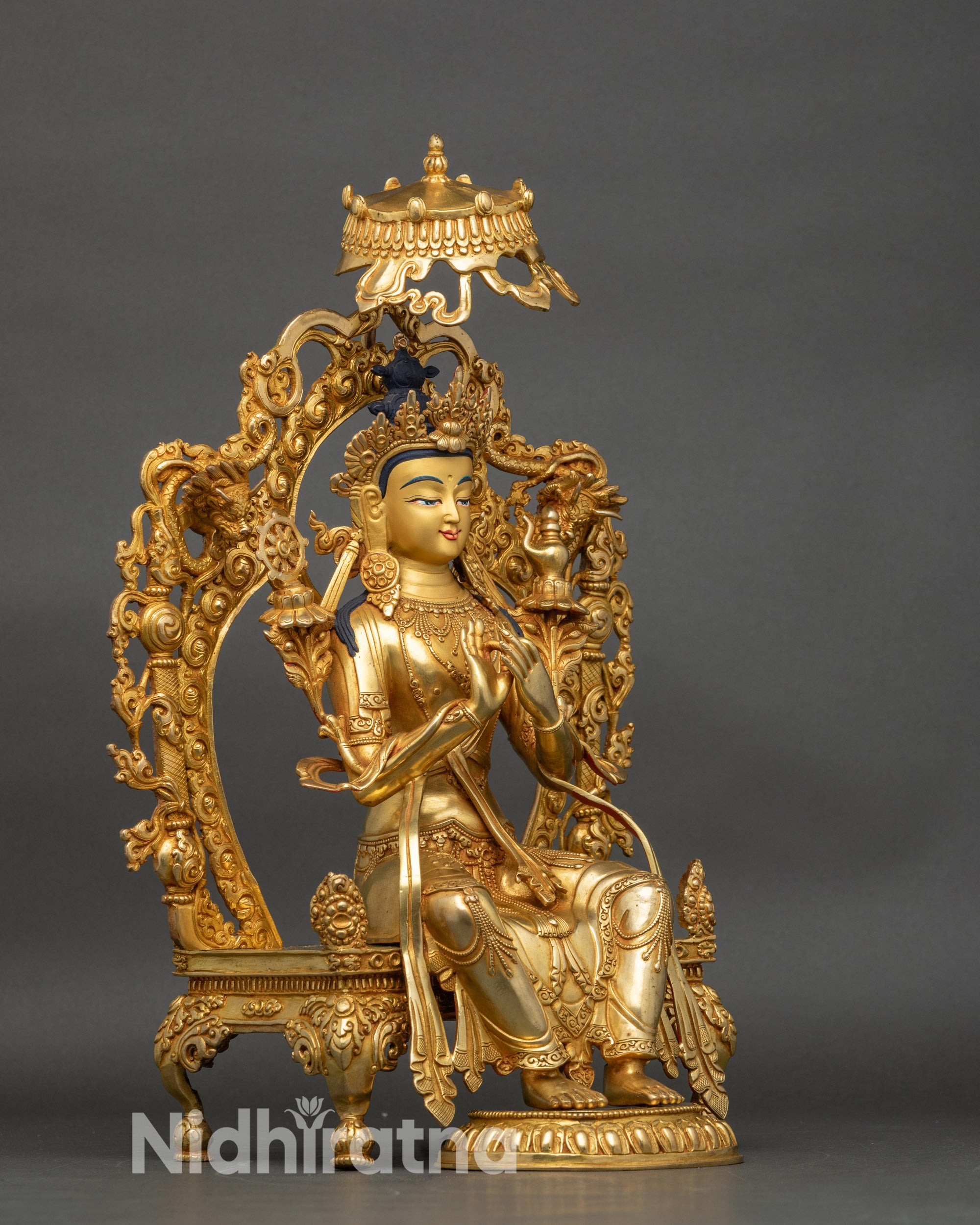 Side view Maitreya Buddha statue seated on majestic throne with parasol umbrella