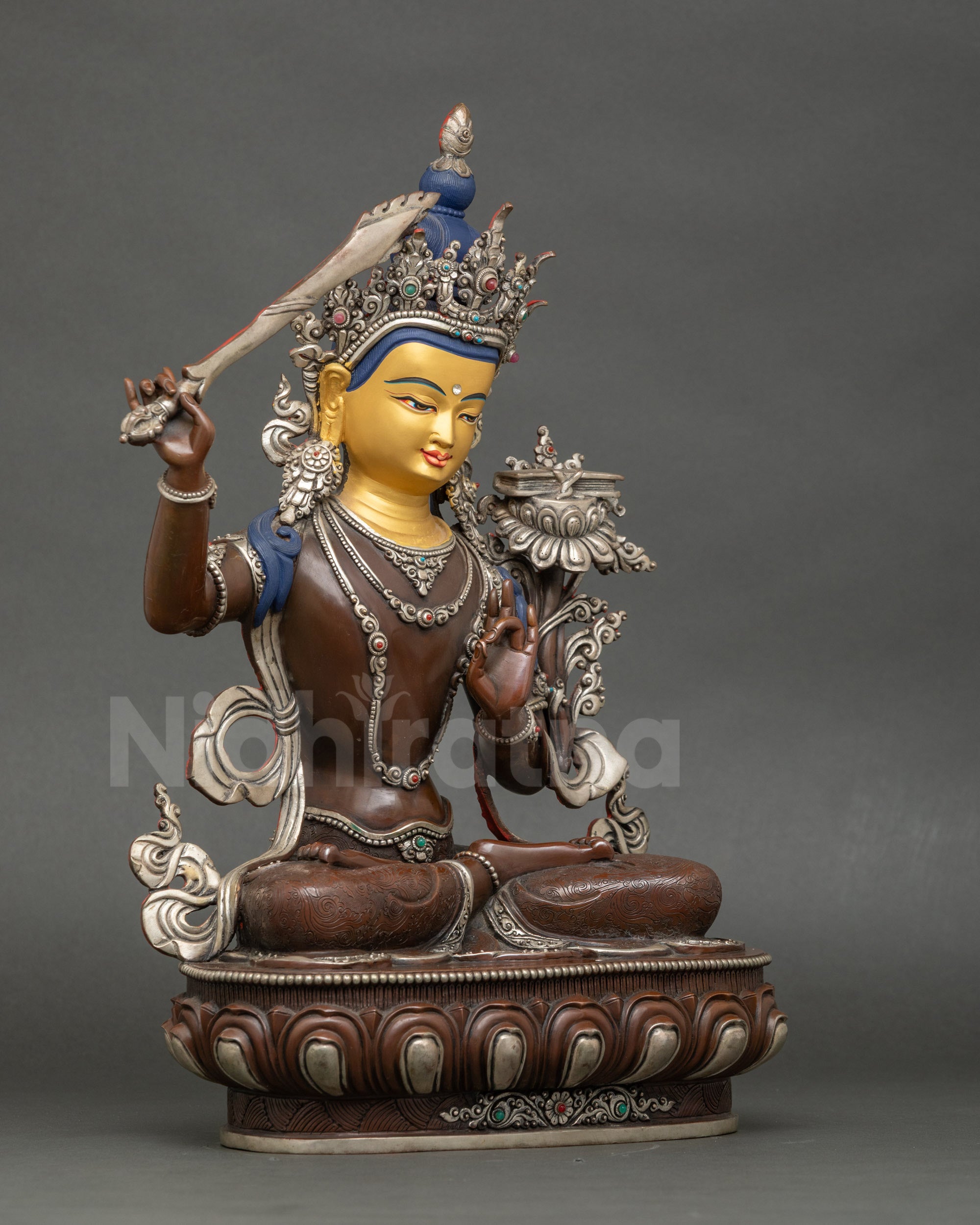 Side view Manjushri seated on lotus throne handcrafted Newari sculpture for altar