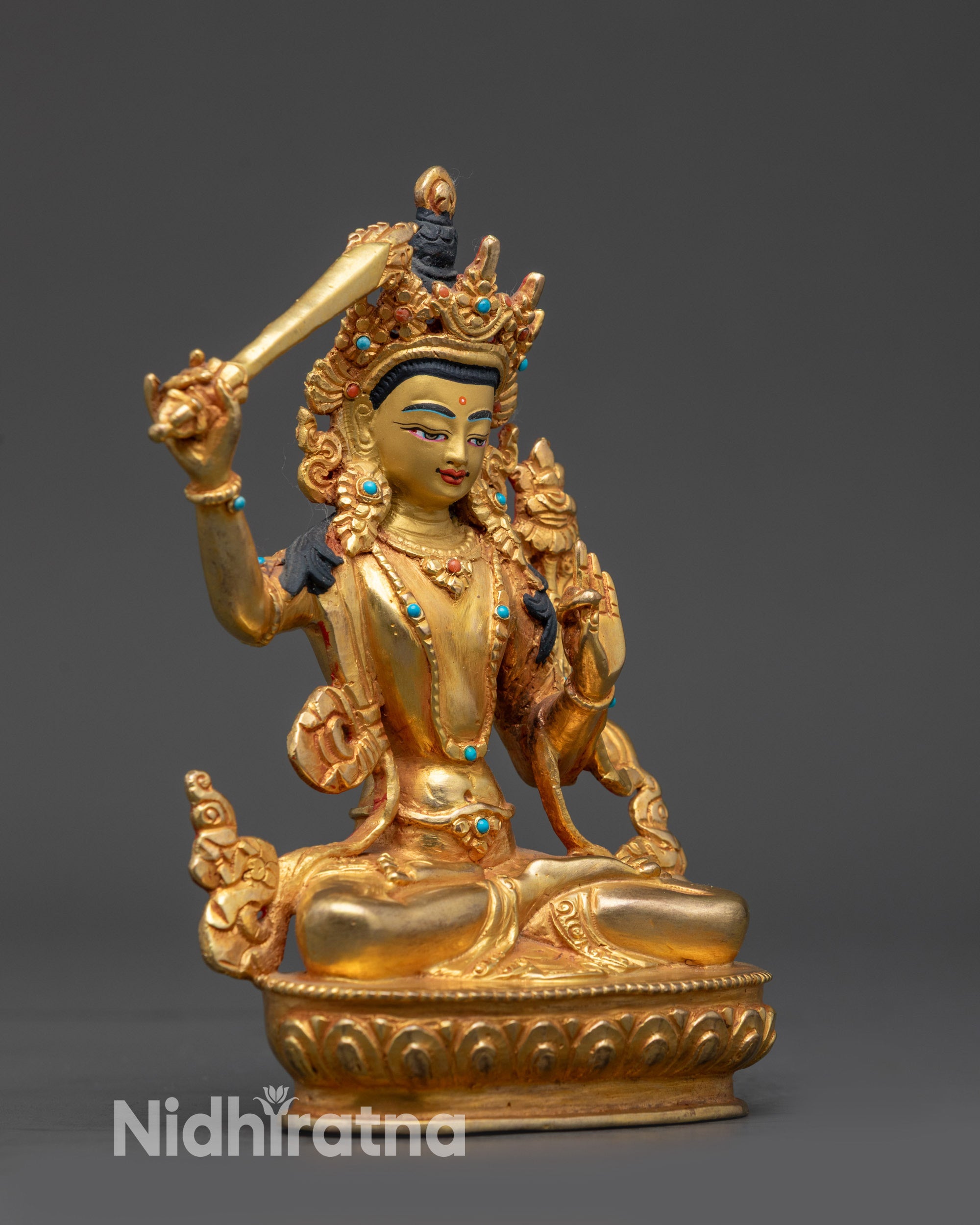 Side view Manjushri Statue holding sword and utpala flower with gold fire-gilding