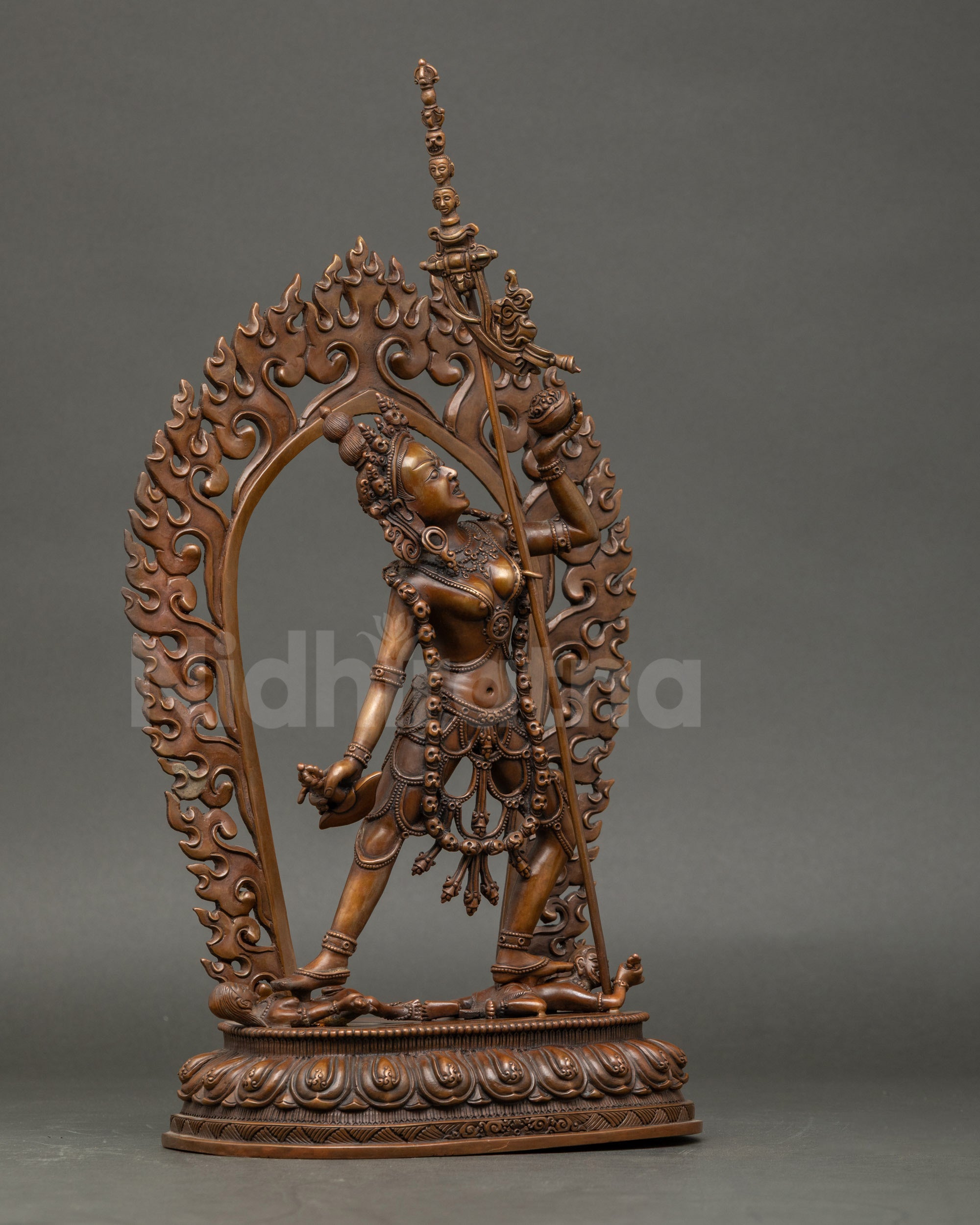 Vajrayogini Dakini standing on subdued figures, tantric Buddhist sculpture