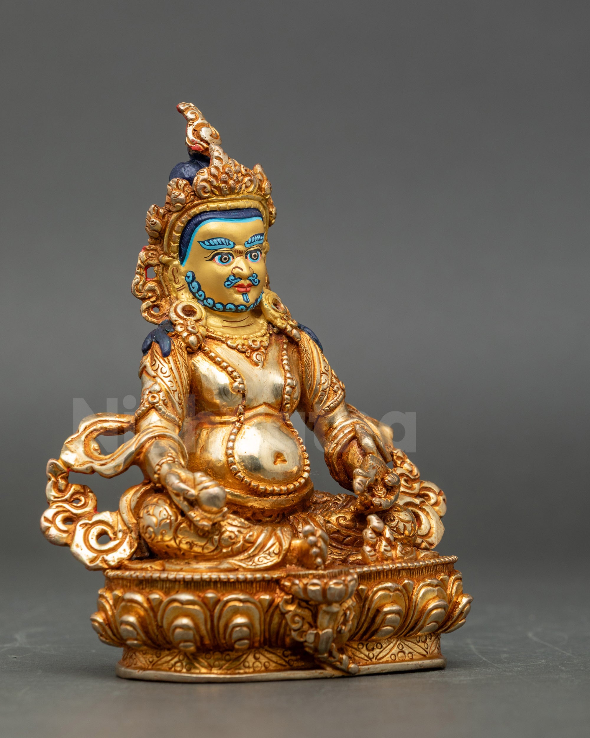 Side view Dzambhala statue copper gold-gilded Hindu-Buddhist deity meditation decor