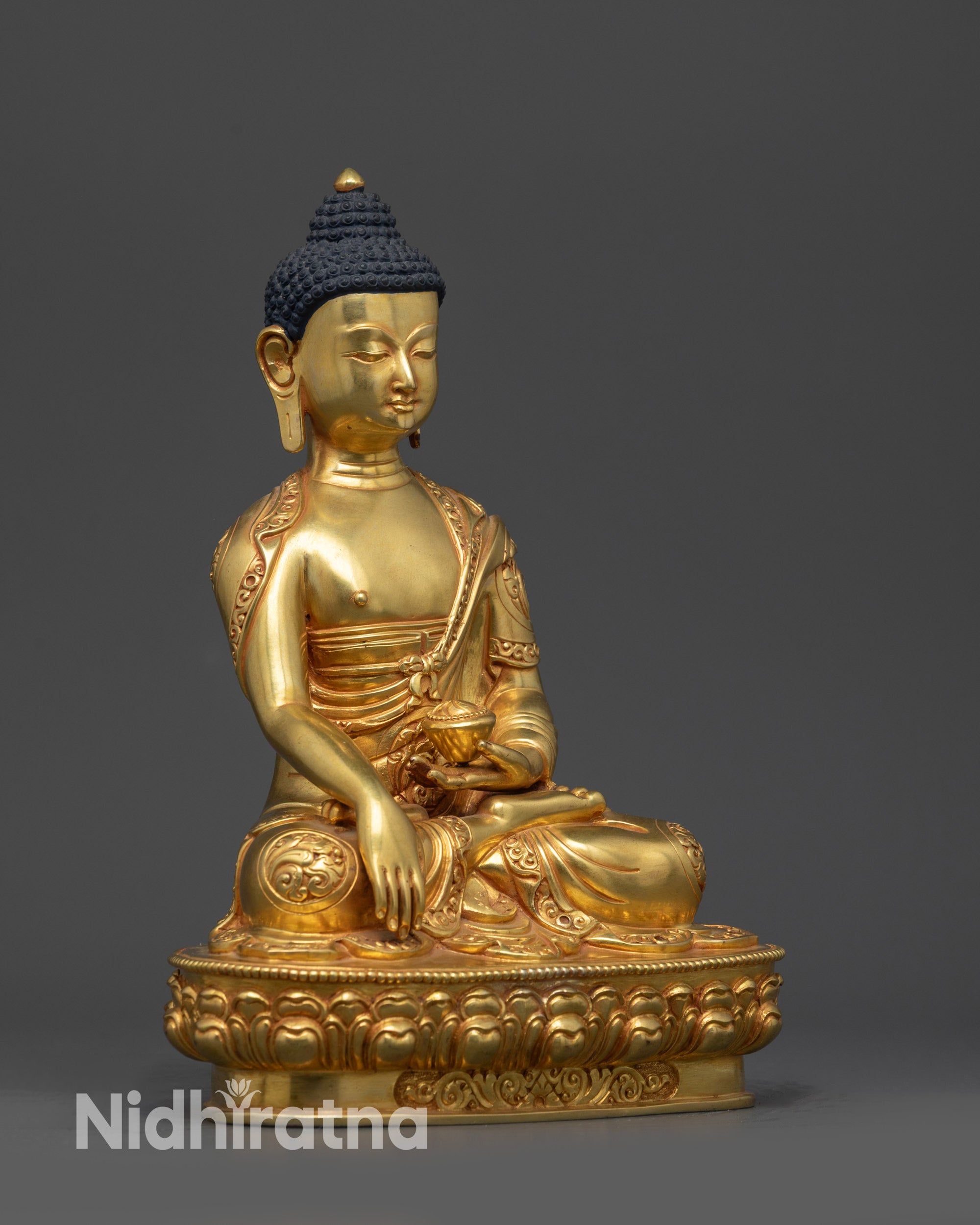 Side view of handcrafted Nepalese Shakyamuni Buddha statue performing earth-touching mudra.