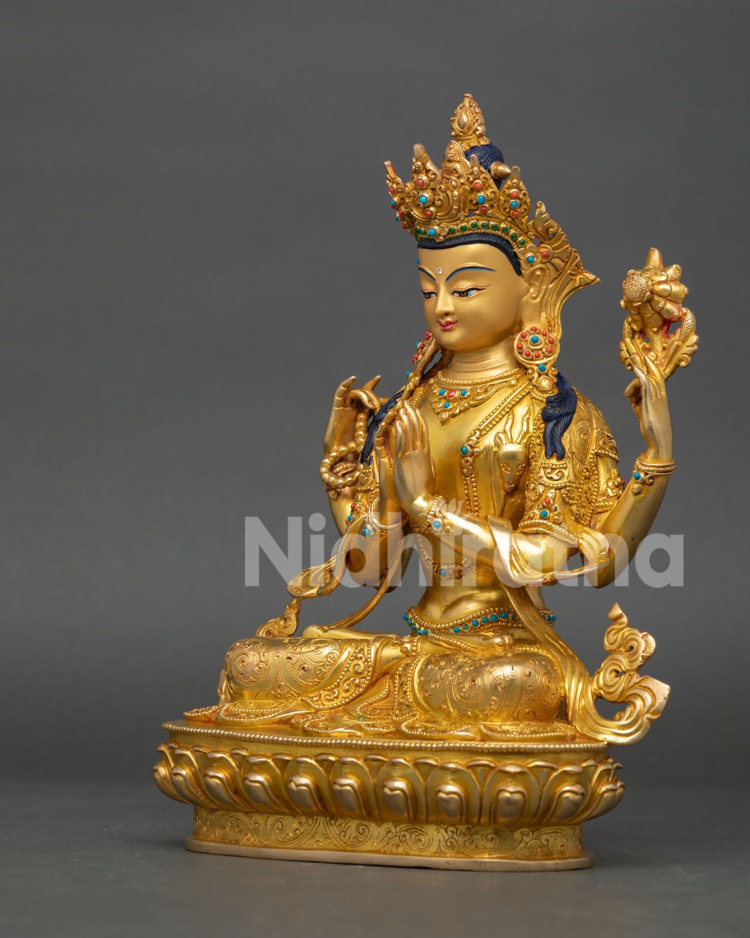 left side view of copper chenrezig statue with traditional himalayan craftsmanship