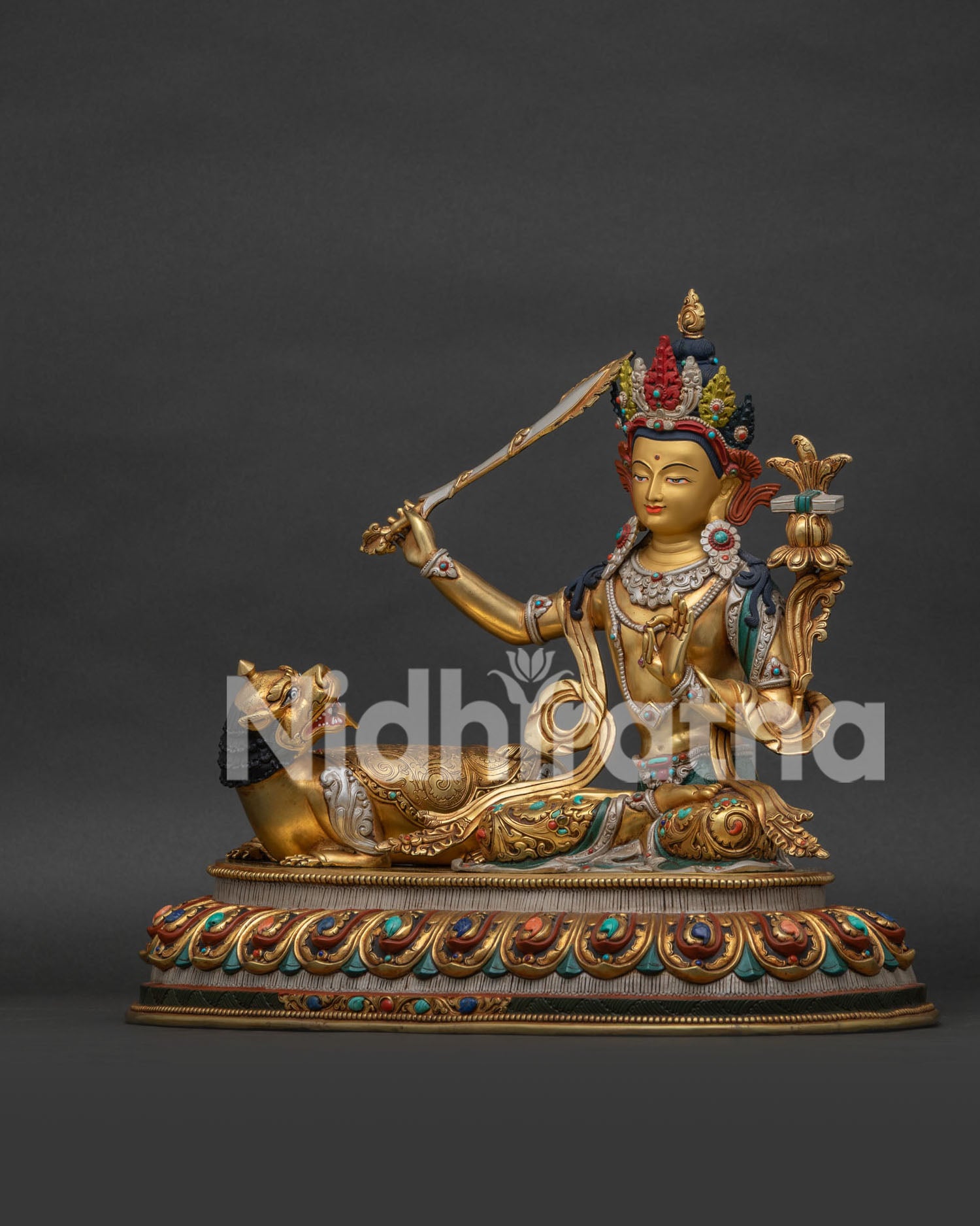 Left side view of Simhanada Manjushri statue showing gold gilded details