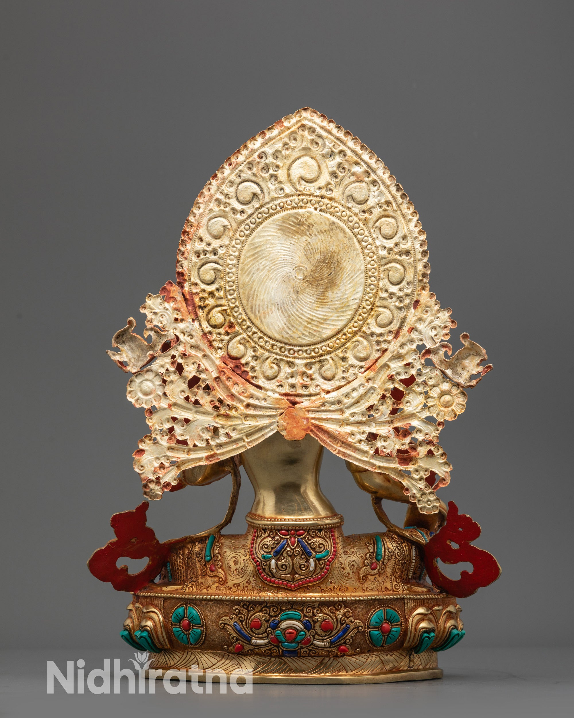 Back view highlighting the carved halo and Robes floral motifs on the Green Tara statue.