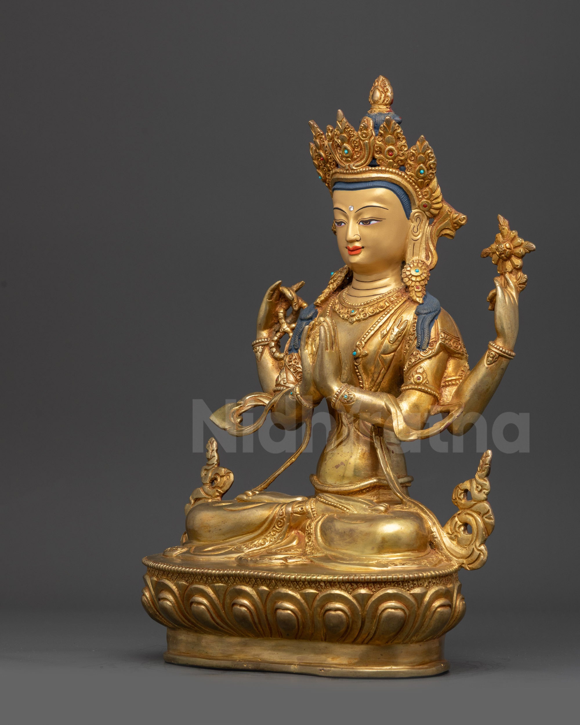 Chenrezig statue left view side Avalokiteshvara lotus flower and ornate robes