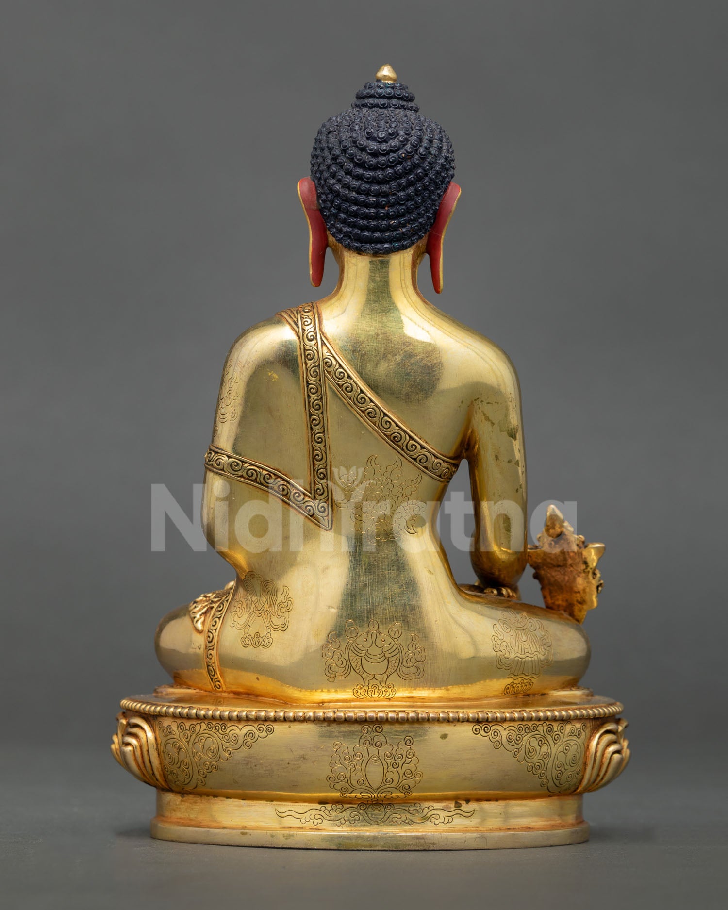 Back view Medicine Buddha statue, engraved lotus pedestal and detailed sacred craftsmanship