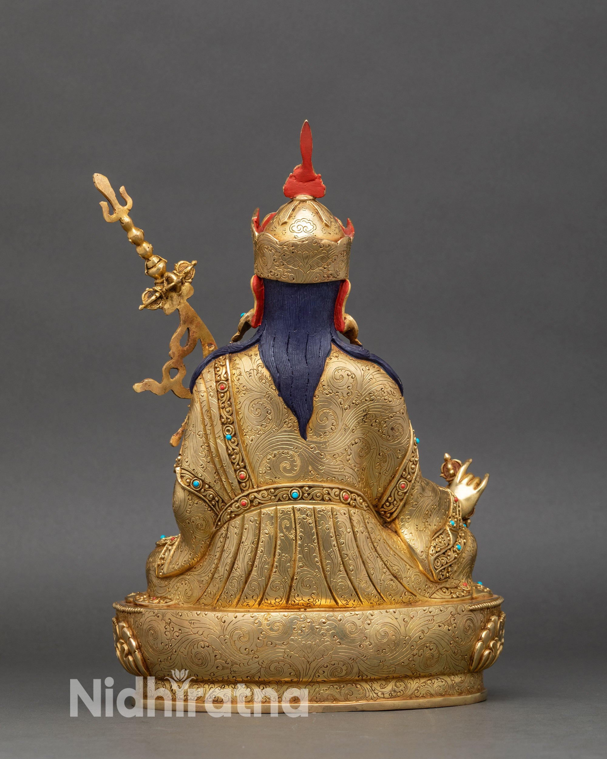 Back view of Guru Padmasambhava Statue showing detailed robes and lotus pedestal artistry