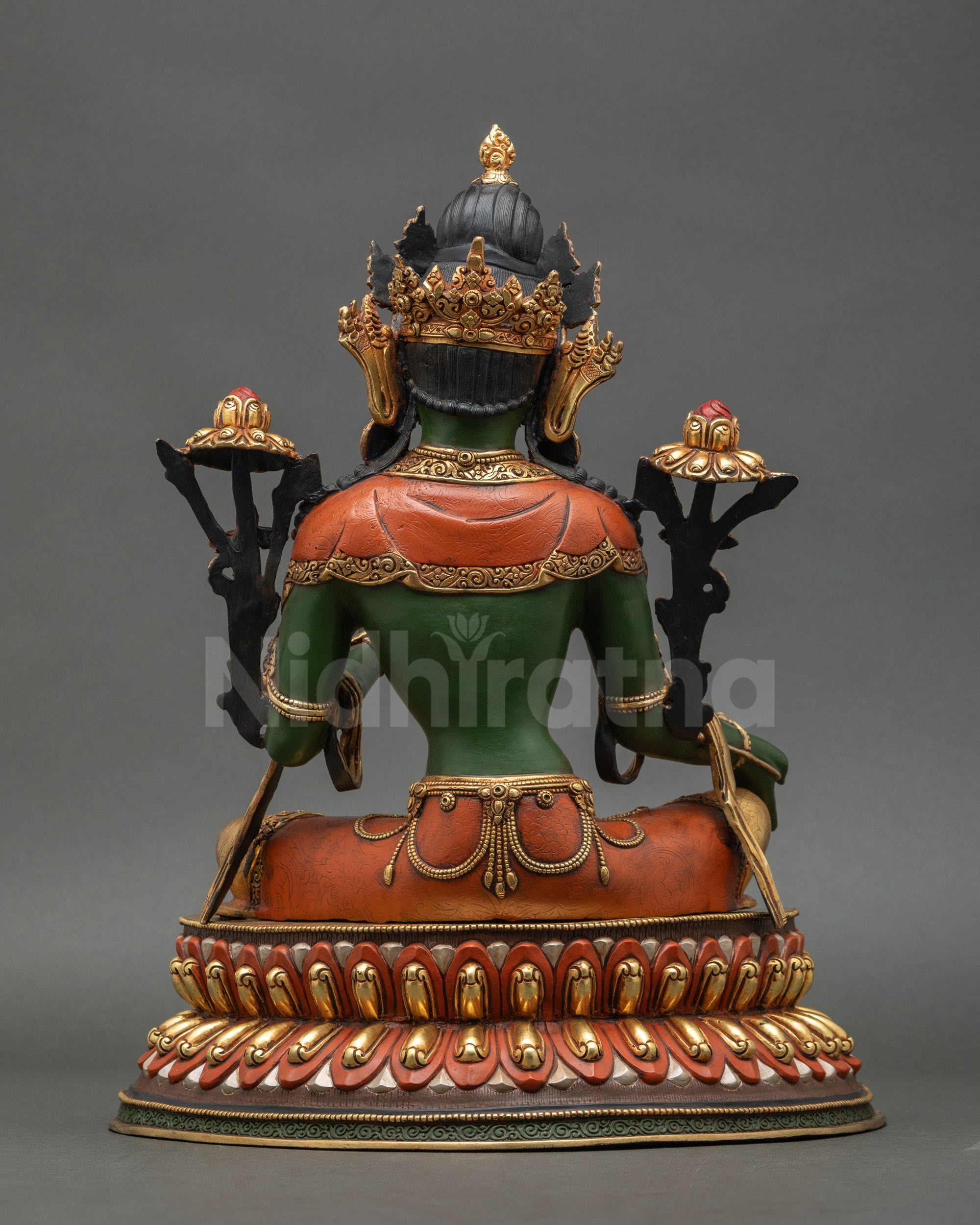Back view of handcrafted Green Tara statue showing detailed carving and copper form
