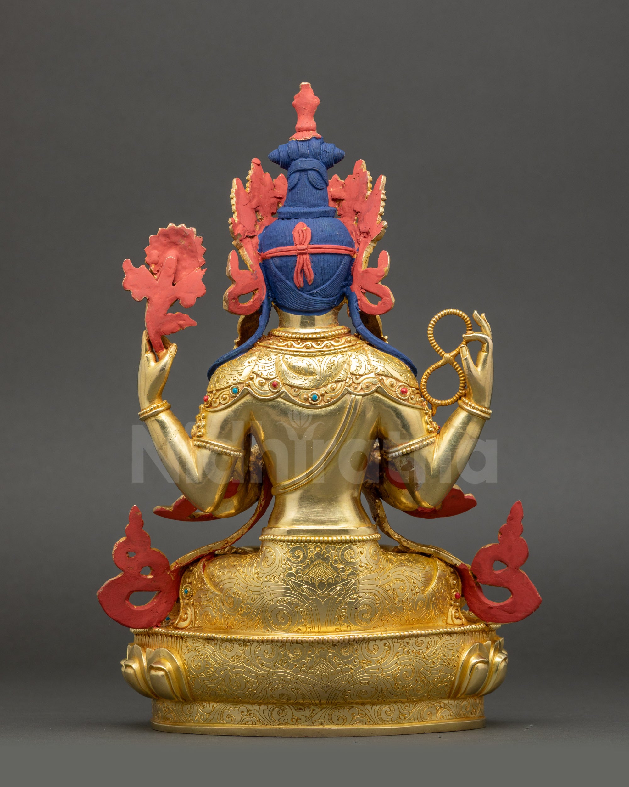 Detailed view of Chenrezig Avalokiteshvara hands with crystal rosary, lotus, and gem