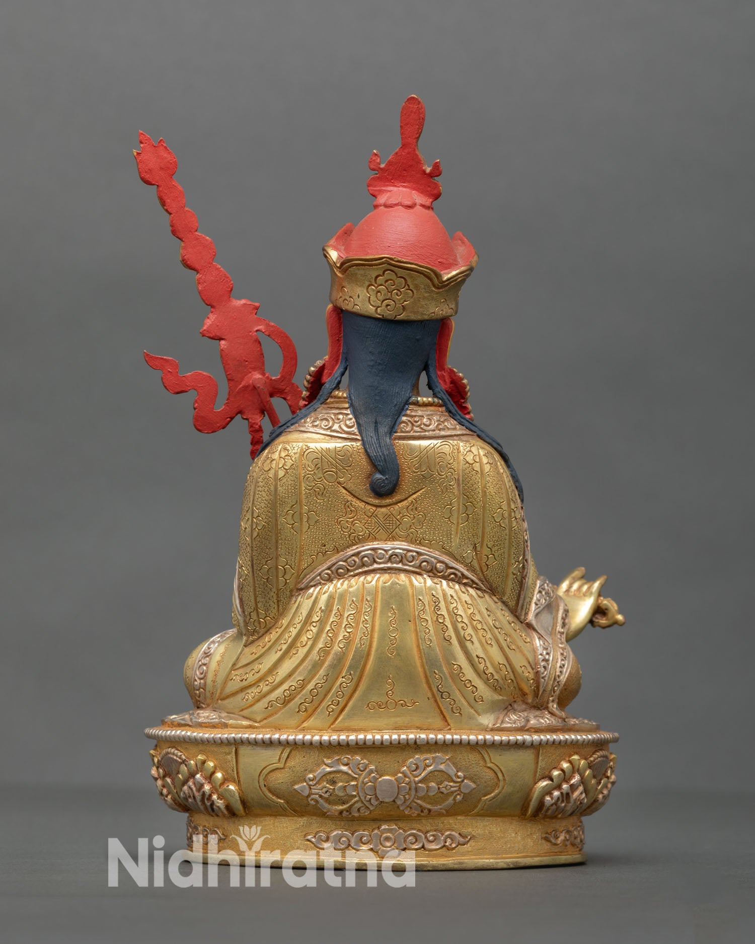 Guru Rinpoche statue back view handcrafted Nepalese Buddhist artwork ornate detailing gold gilded accents spiritual altar home decor statue