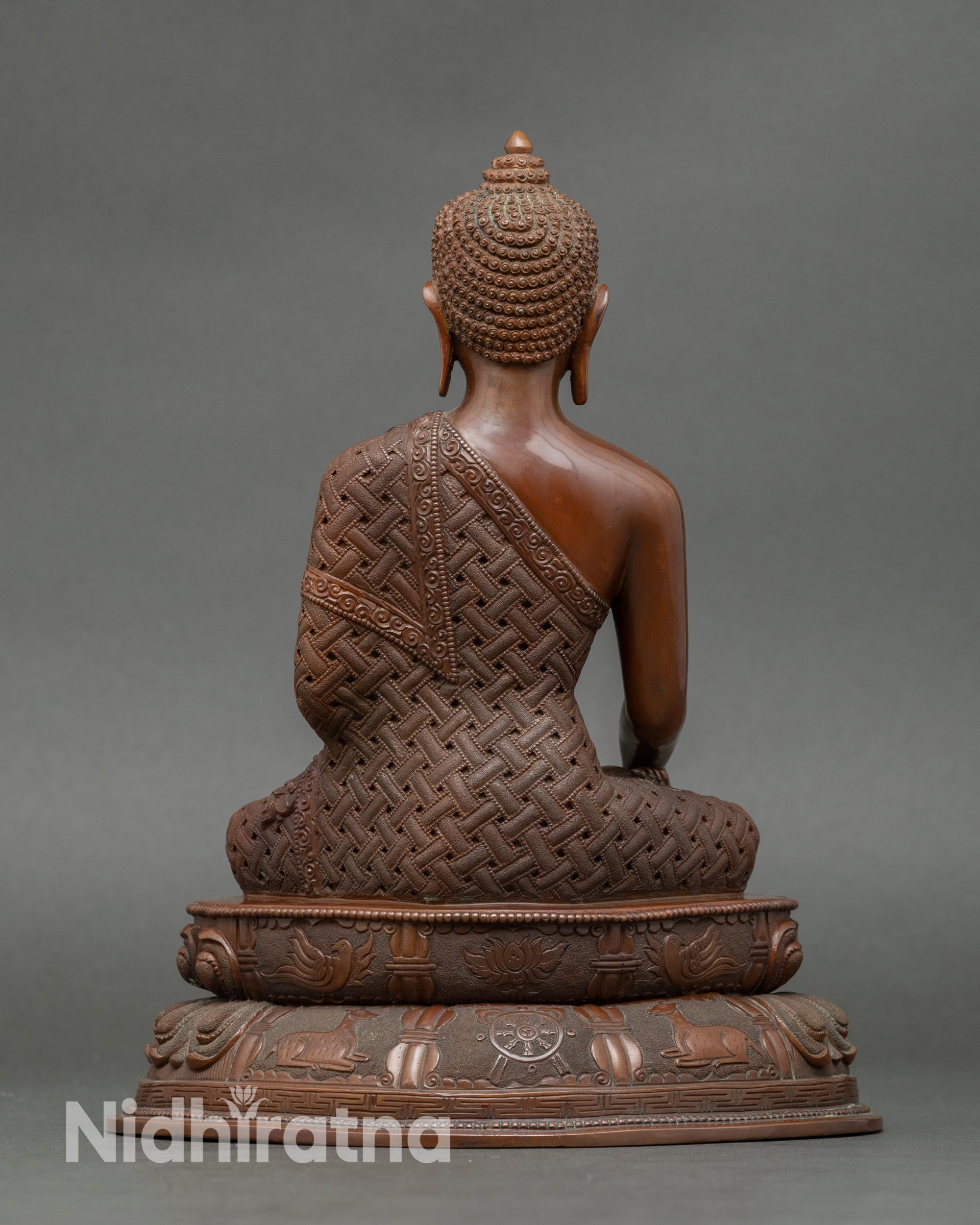 Back view of Buddha Shakyamuni altar statue, copper artwork with intricate detailing
