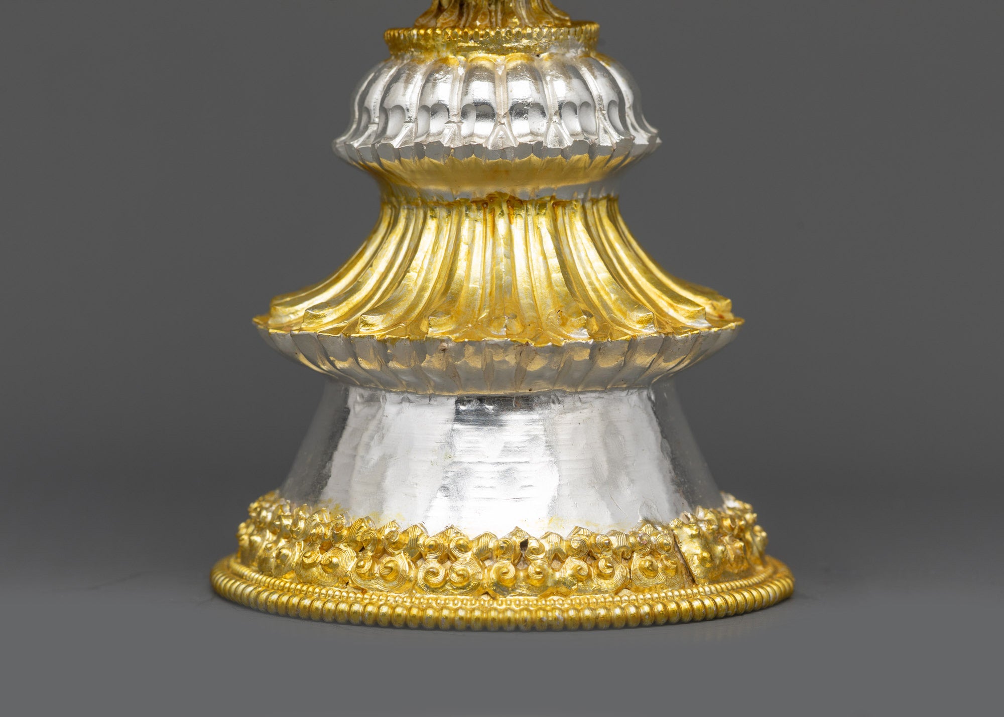 Close up of silver filigree and gold-plated Auspicious symbols on Butter Lamp Set