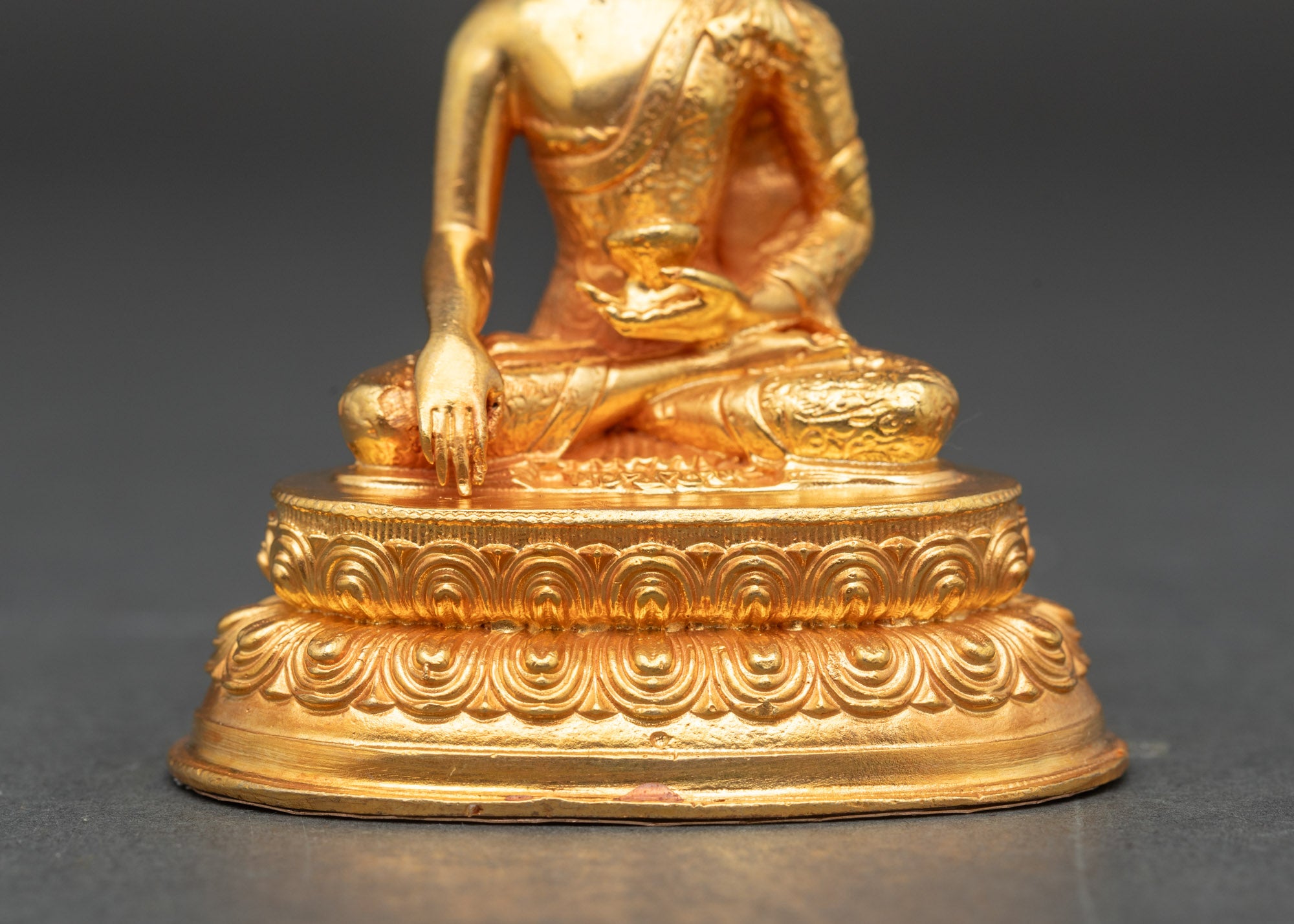 Shakyamuni Buddha holding monk’s bowl, electroplated gold detailing, Himalayan art