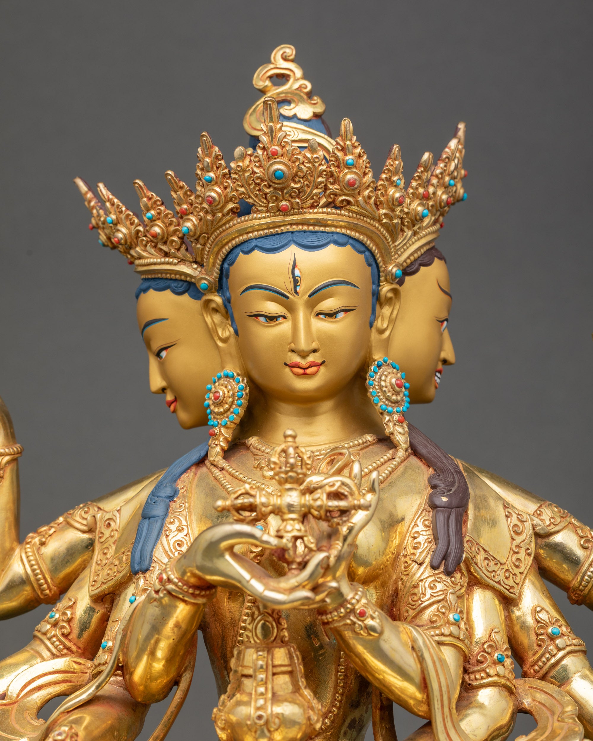 Close-up of Namgyalma deity face, 24K gold-painted, handcrafted Nepalese Buddhist art