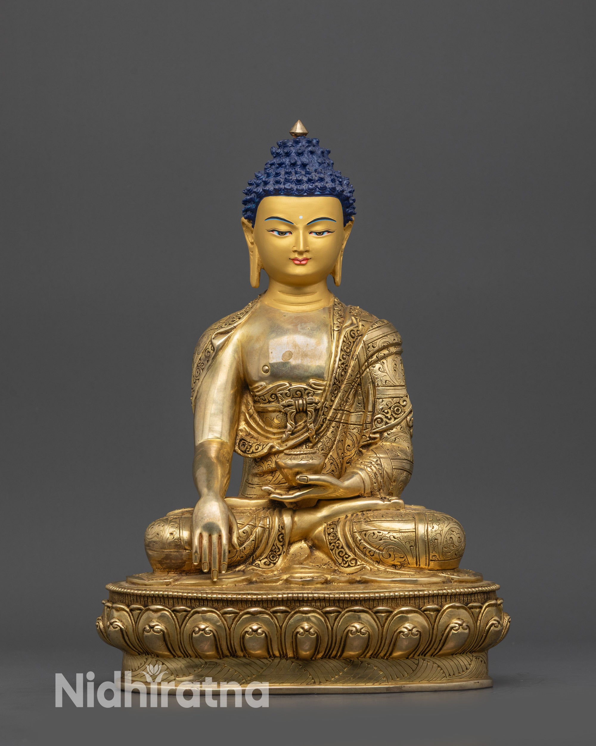 front view Shakyamuni Buddha statue with gold-gilded face and lotus throne