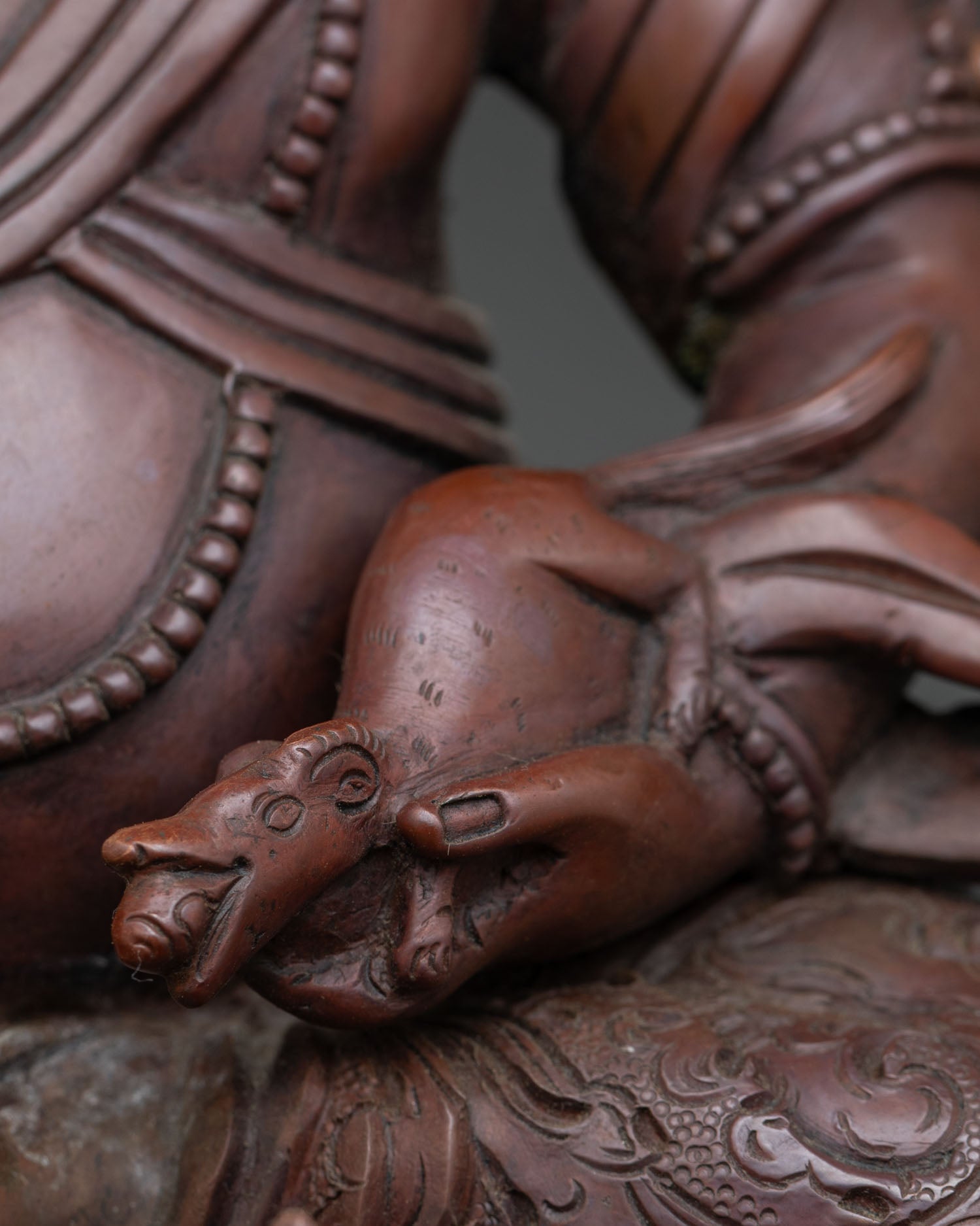 Dzambhala In Ornate Throne Statue | Brown Oxidized Copper Sculpture