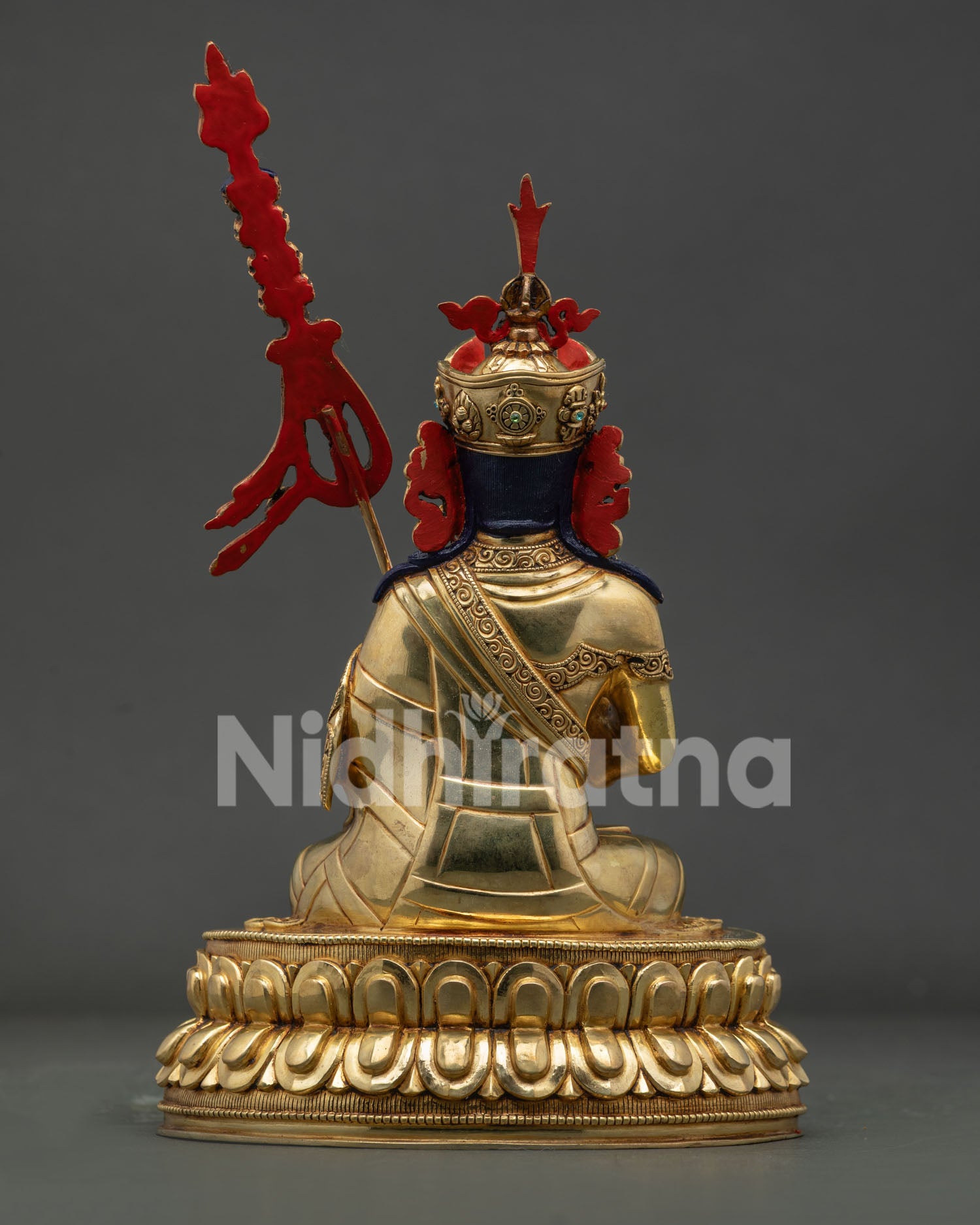 Back view of Guru Tsokye Dorje Statue displaying intricate robe carvings and copper craftsmanship