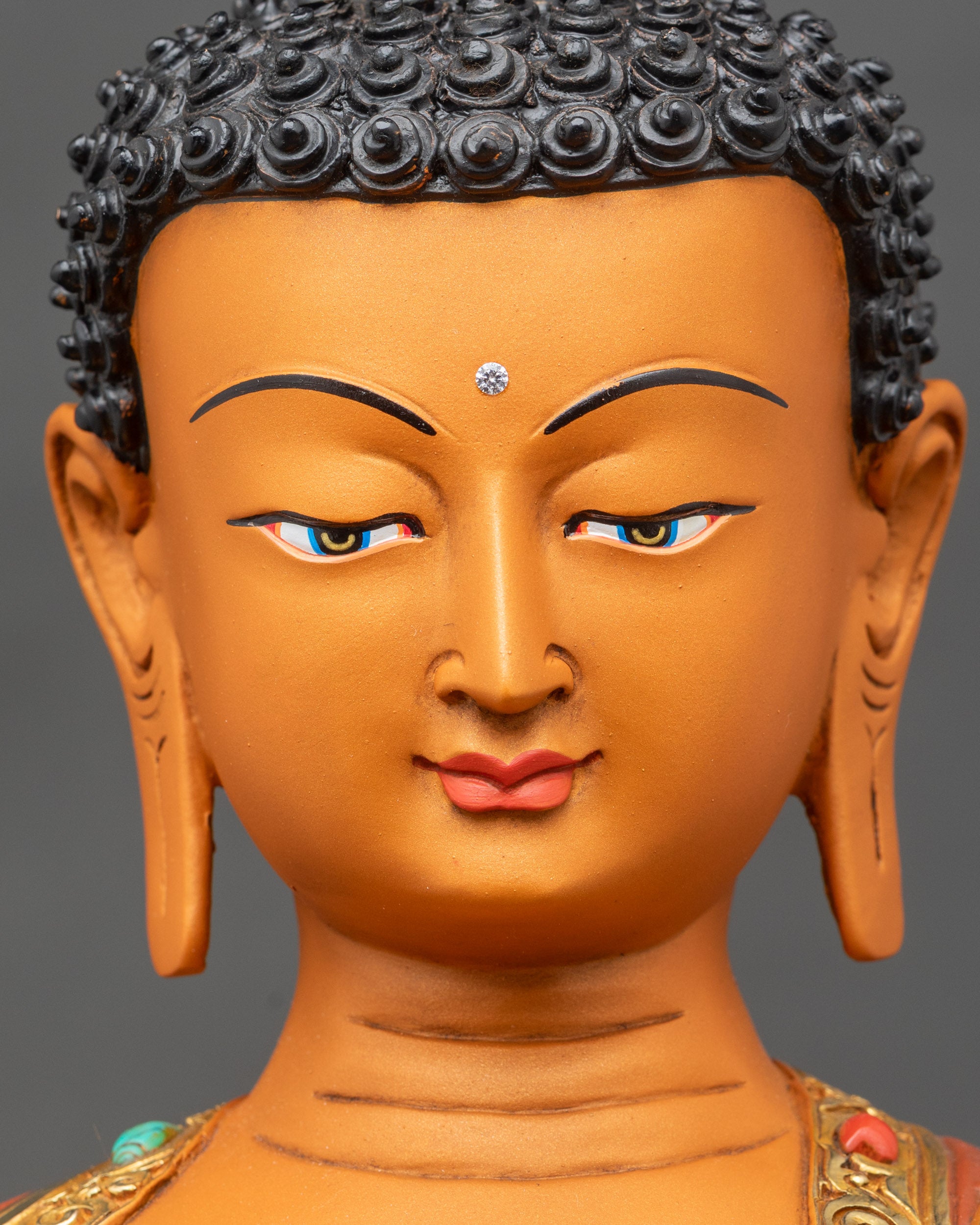 Face close-up of Shakyamuni Buddha, deep-blue eyes and peaceful expression