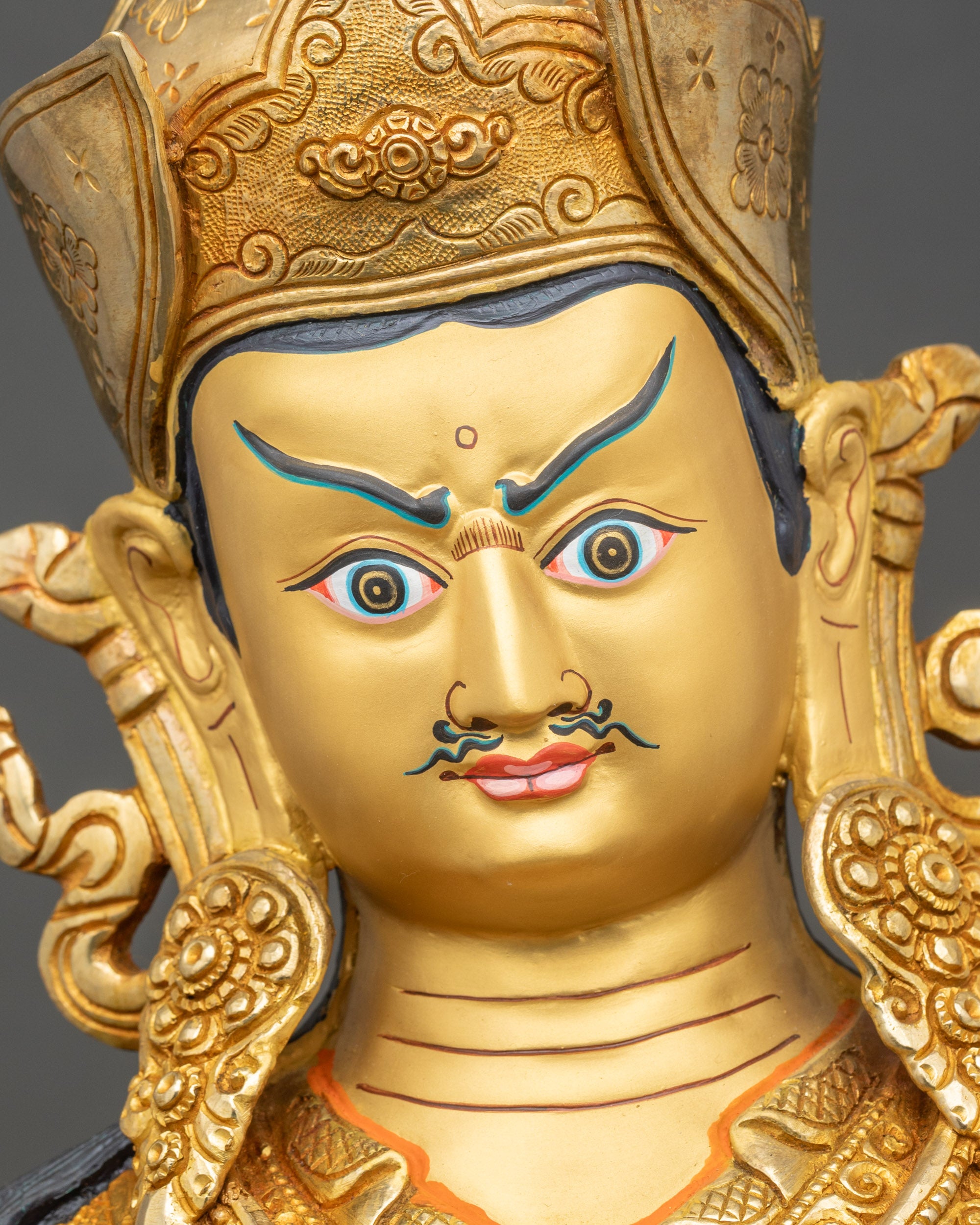 Face of Guru Rinpoche meditation statue, 24k gold-painted, serene Tantric expression
