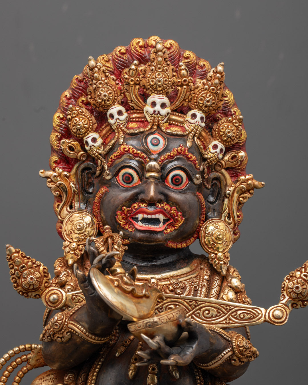 Fierce Shakya Mahakala statue standing on lotus throne with skull crown and halo details