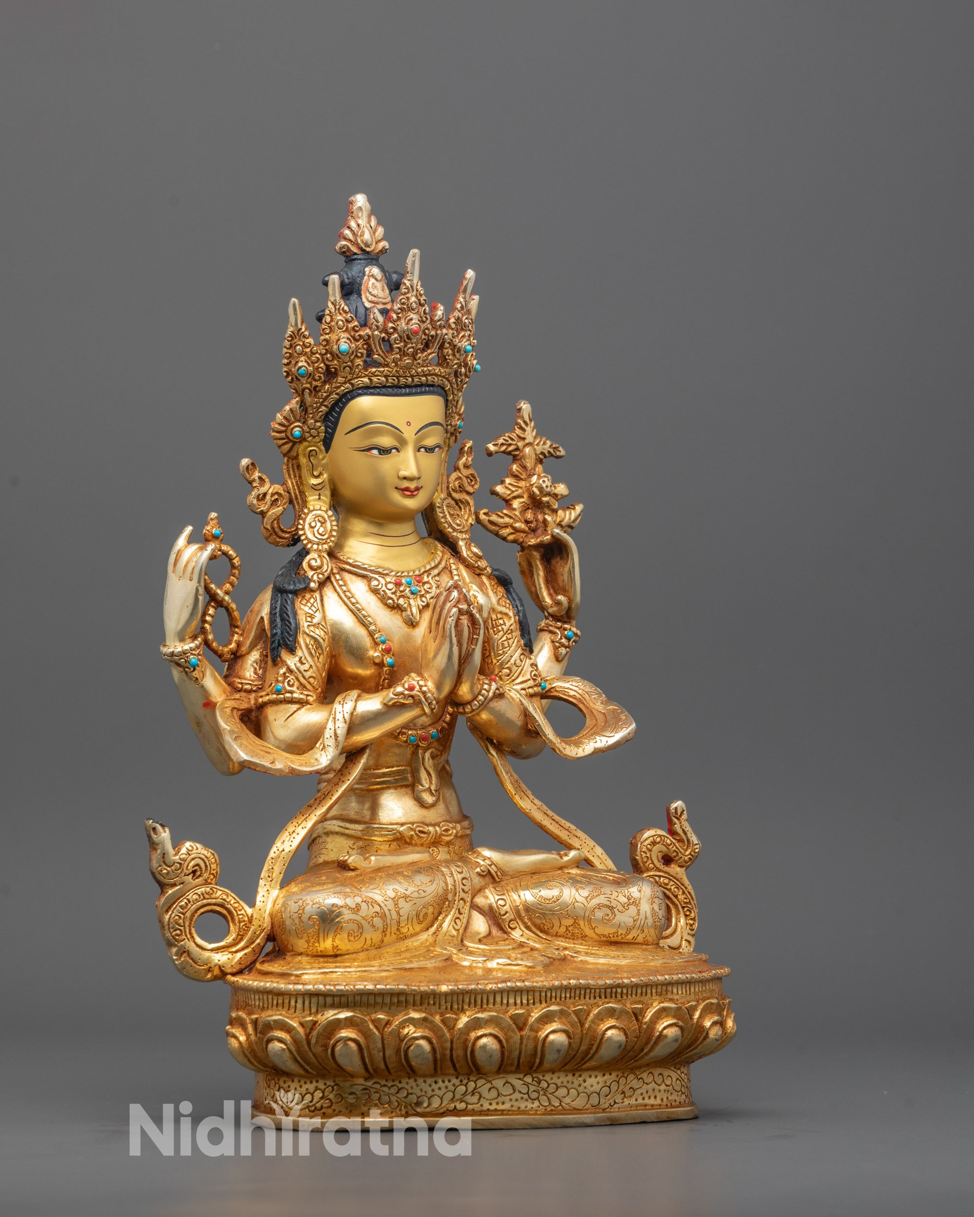 Four-armed Chenrezig holding a lotus, mala, and wish-fulfilling jewel