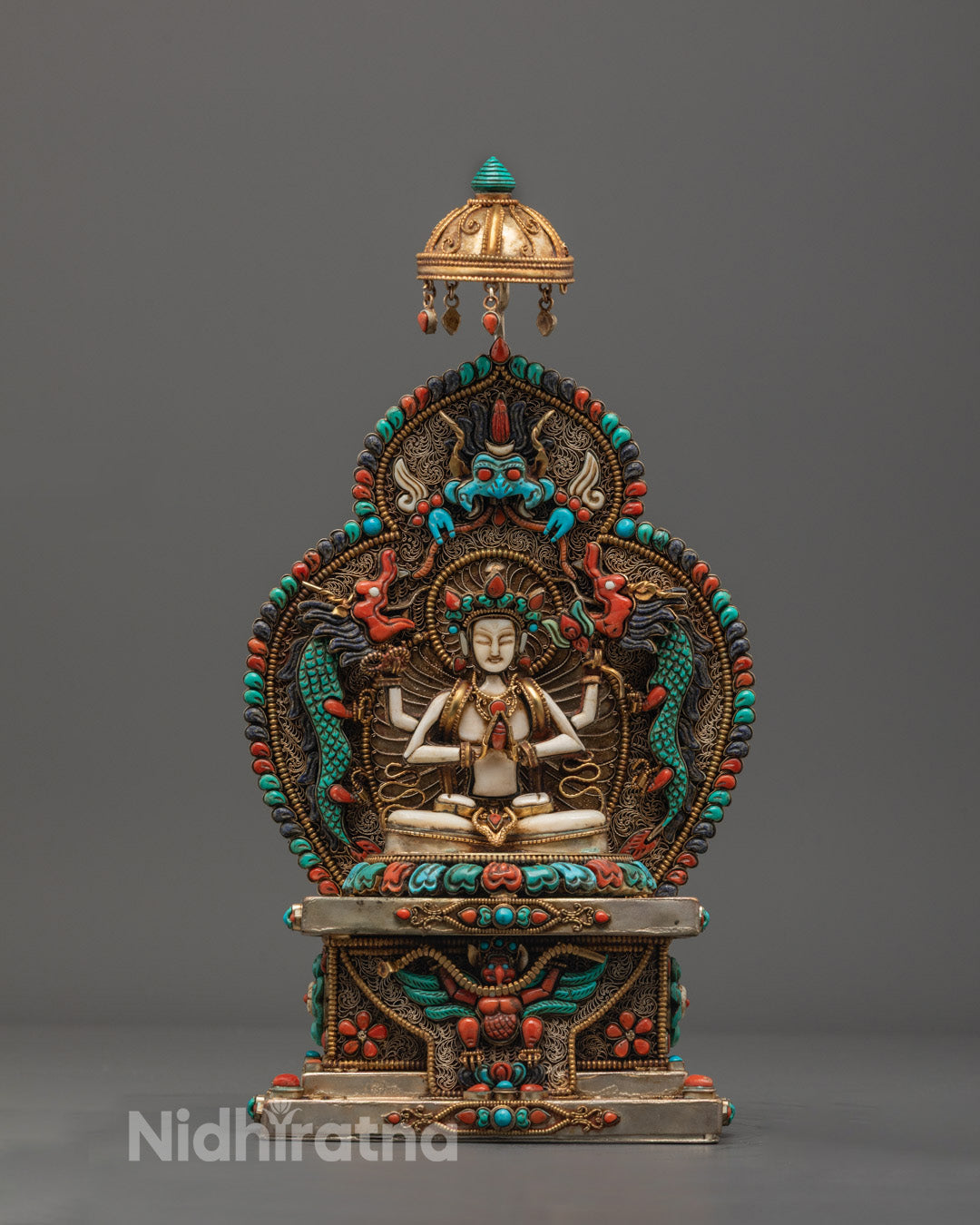Four-armed Chenrezig statue seated in meditation, with semi-precious stone inlays and copper throne, handcrafted in Nepal