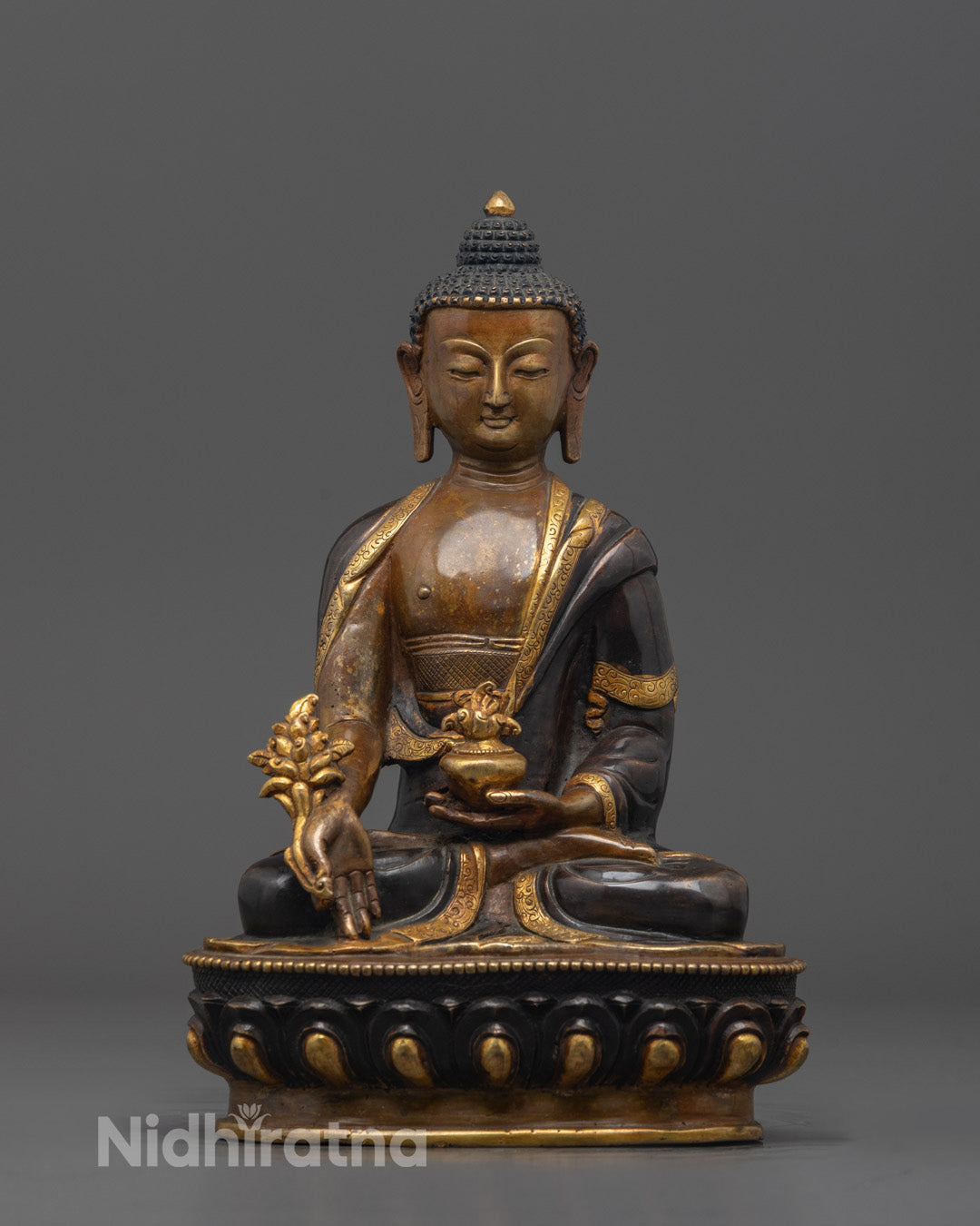 Front-facing view of the Oxidized Medicine Buddha Statue seated on a lotus throne