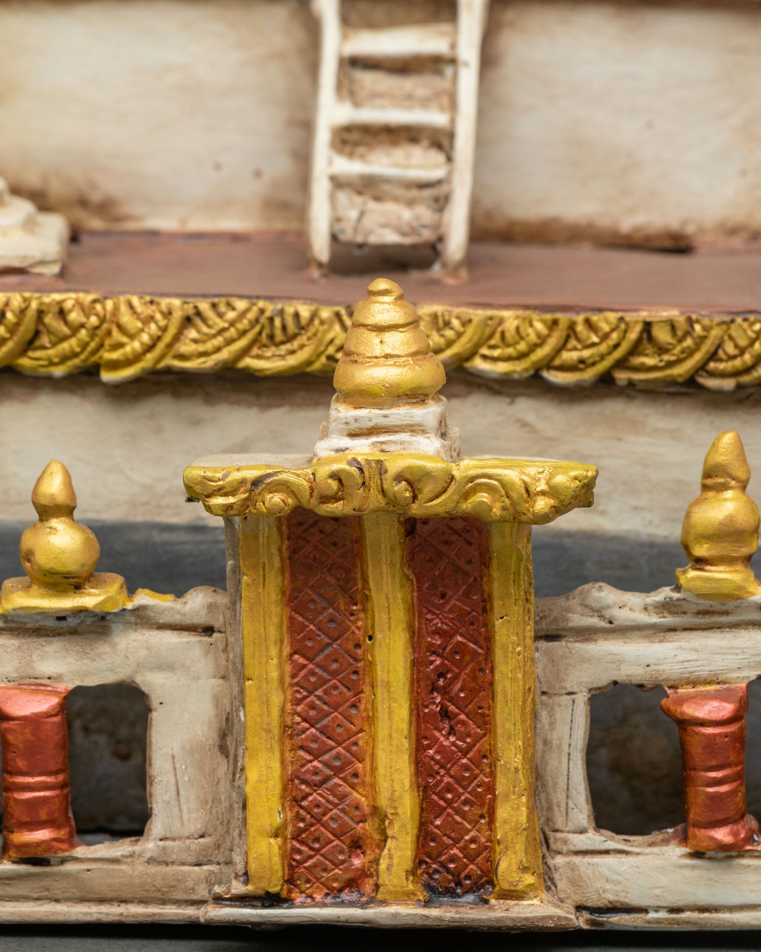 Front gate detail of Boudhanath Stupa replica with intricate painted design