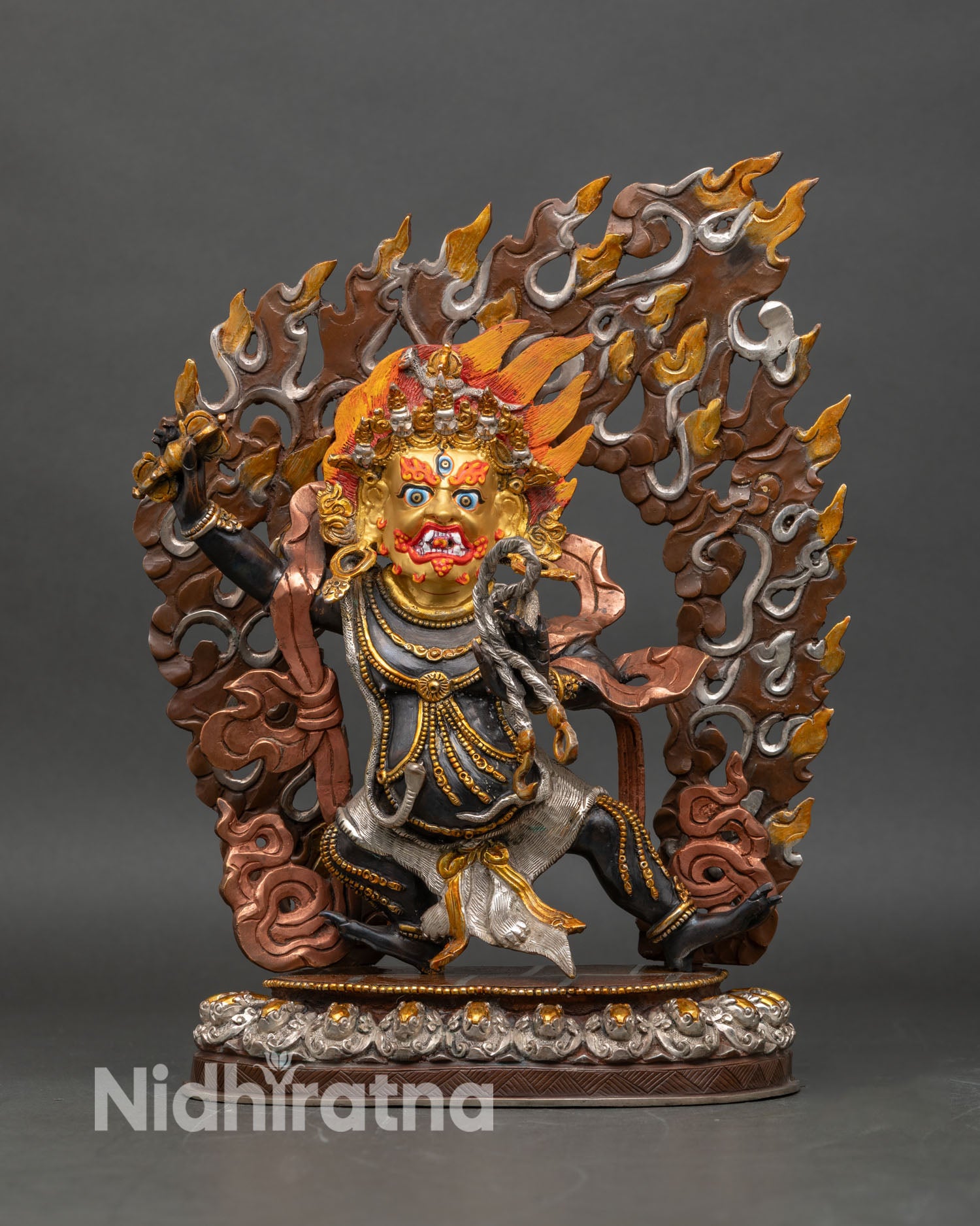 Front view of Vajrapani gold painted face copper statue Tibetan protector Himalayan art