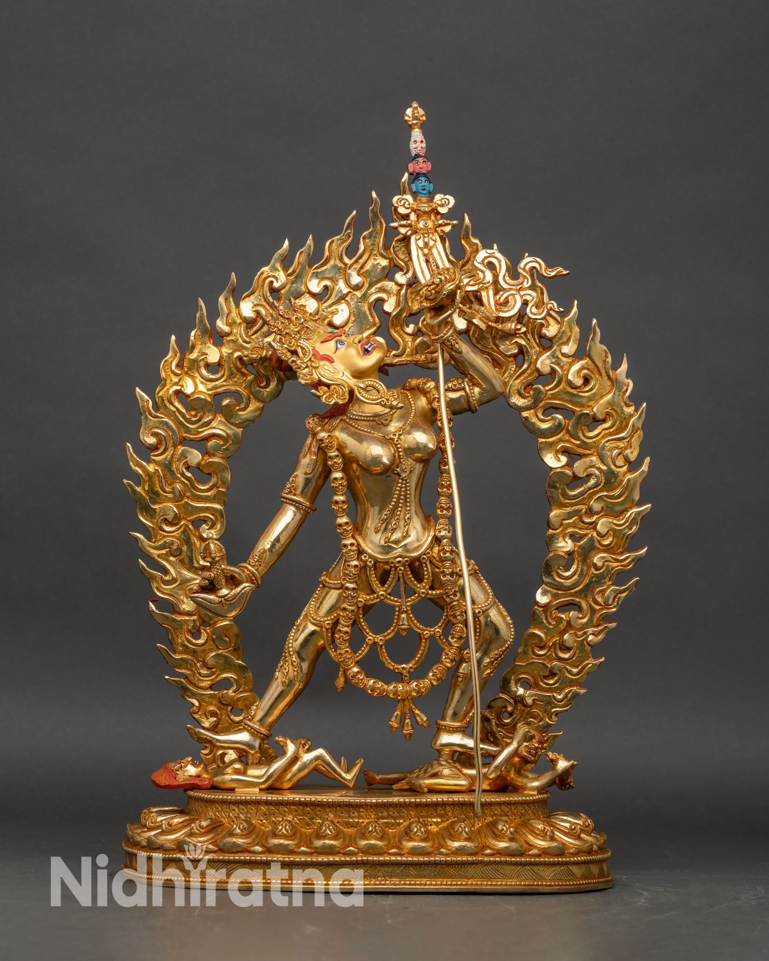 Front view of Vajrayogini gold gilded copper statue holding kartika and skull cup Himalayan art