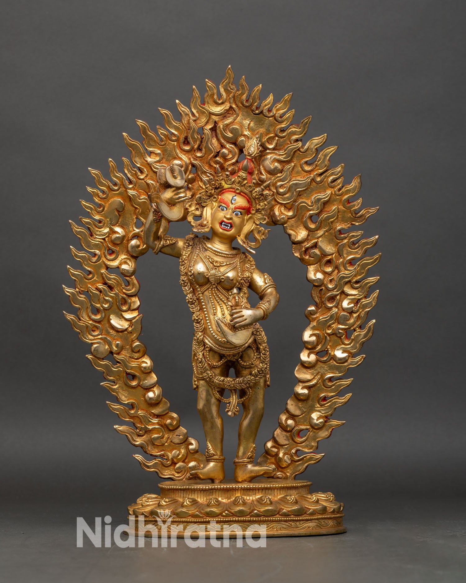 Front view of Yumka Dechen Gyalmo gold gilded statue Tibetan dakini lotus base Nepal art