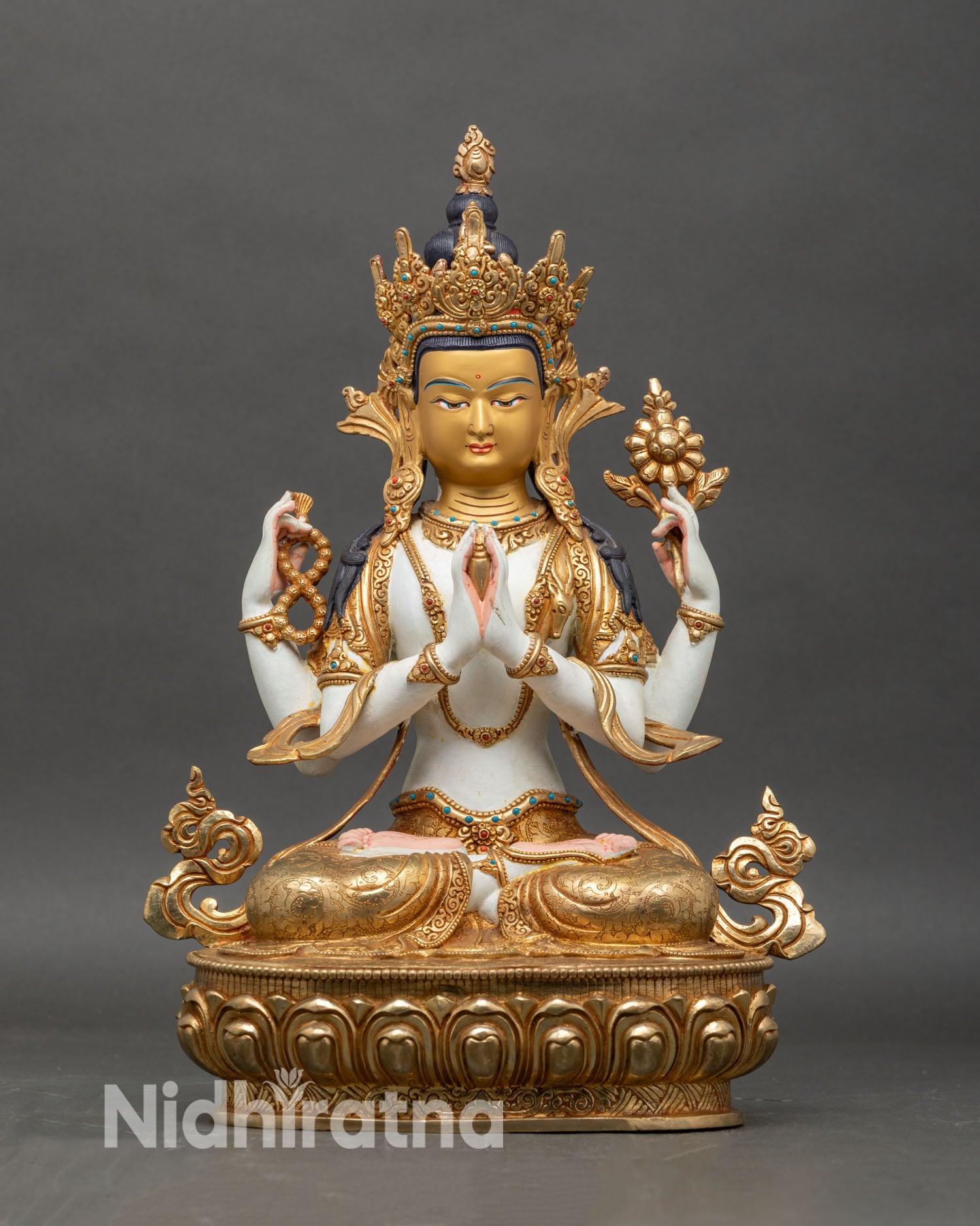 Front view of Four-Armed Chenrezig Buddha statue with gold-gilding and lotus-throne