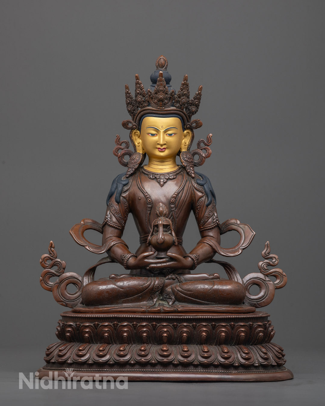 Front-view of Hand-carved Amitayus Buddha statue with oxidized copper body