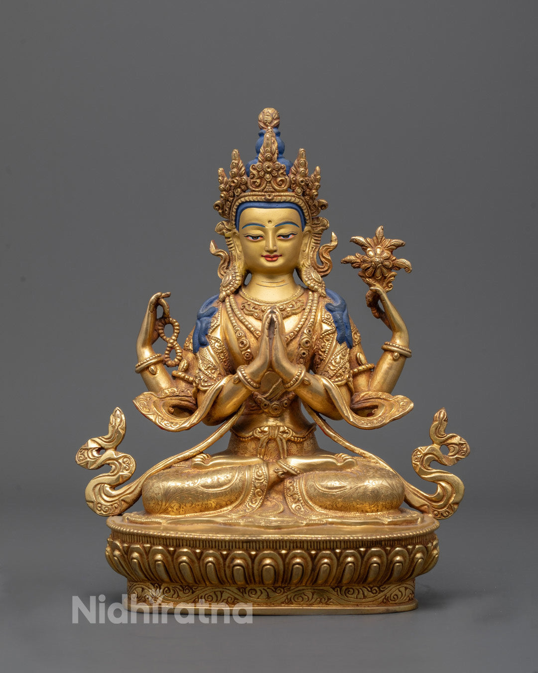 Front-view of Hand-carved Chenrezig statue with 24k gold-gilded face seated on lotus throne