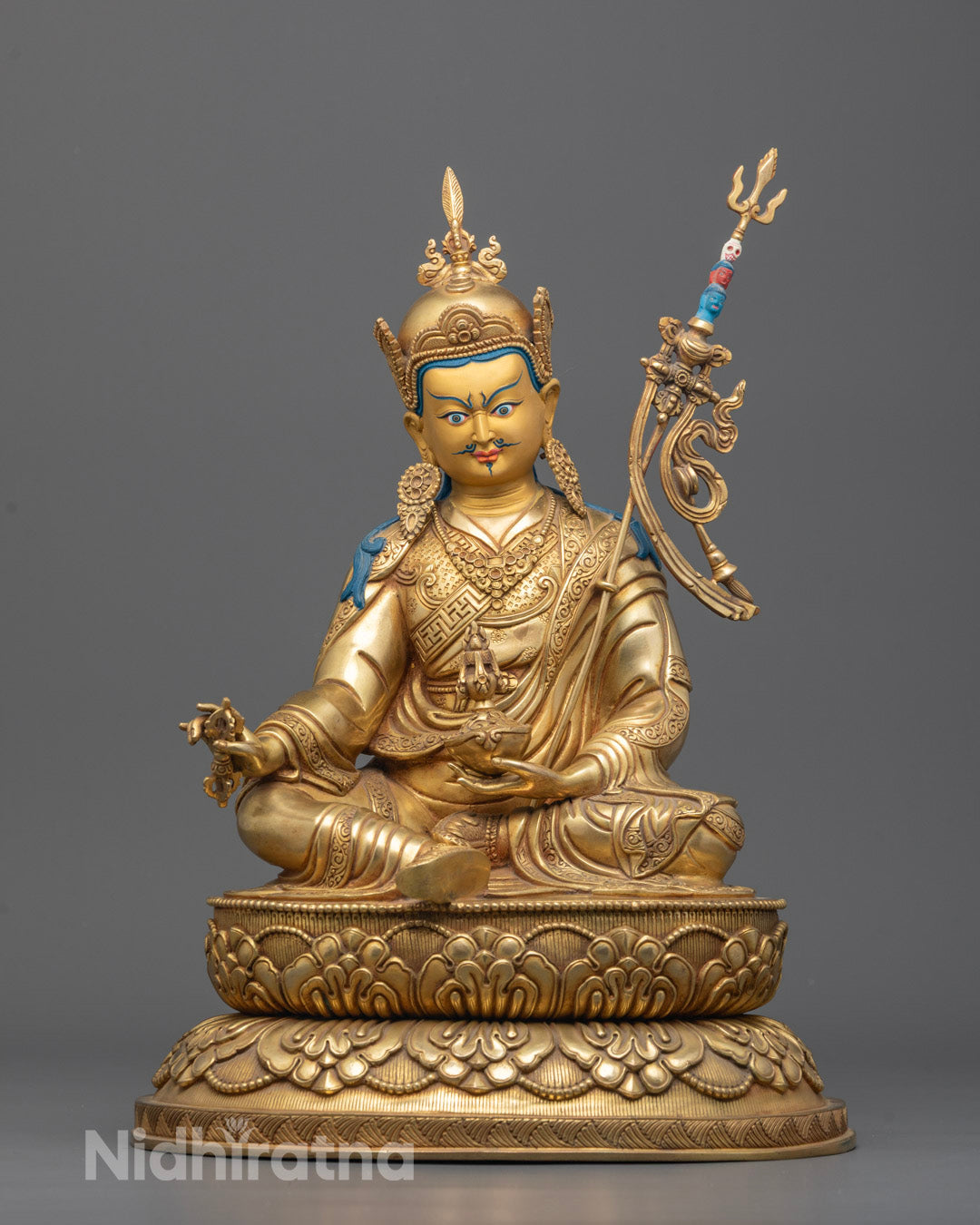 Front-view of carved Guru Rinpoche Statue seated on double lotus base