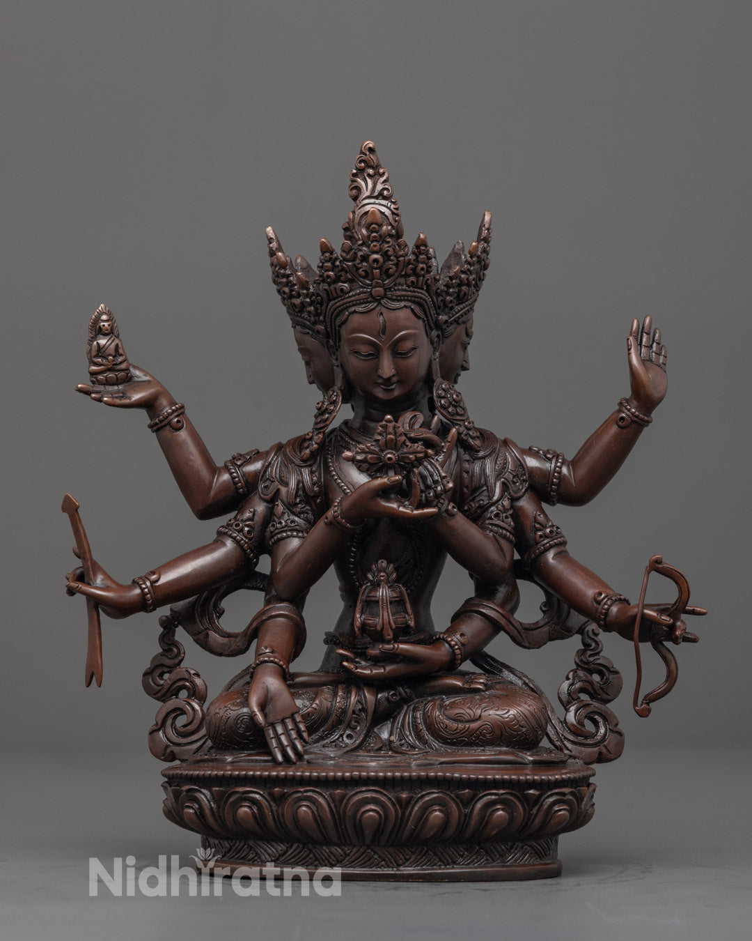 Front image of Hand-carved Namgyalma Sculpture in oxidized copper, seated on a lotus base