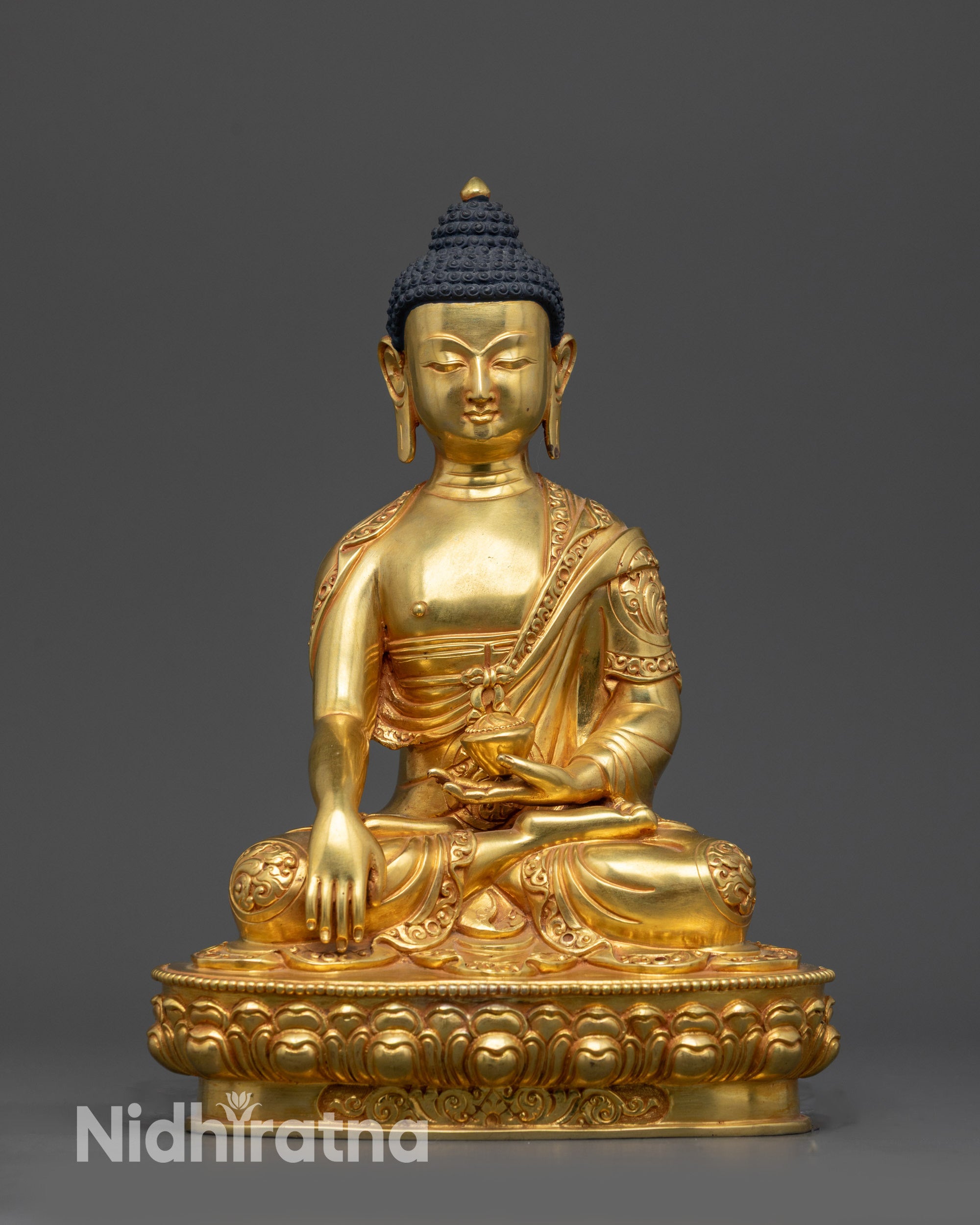 Front view 24K gold-gilded Shakyamuni Buddha statue on lotus seat with patra bowl.