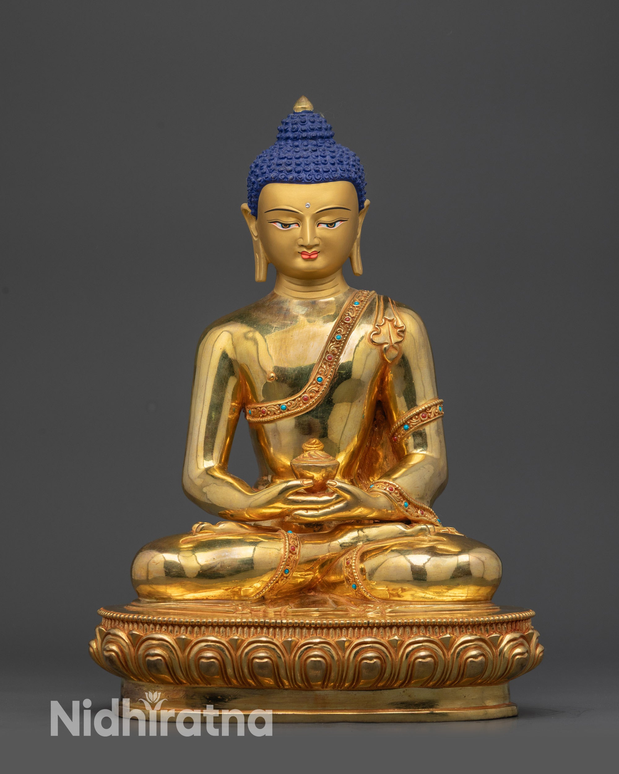 Front view Amitabha Buddha statue with gold-gilded body on lotus seat