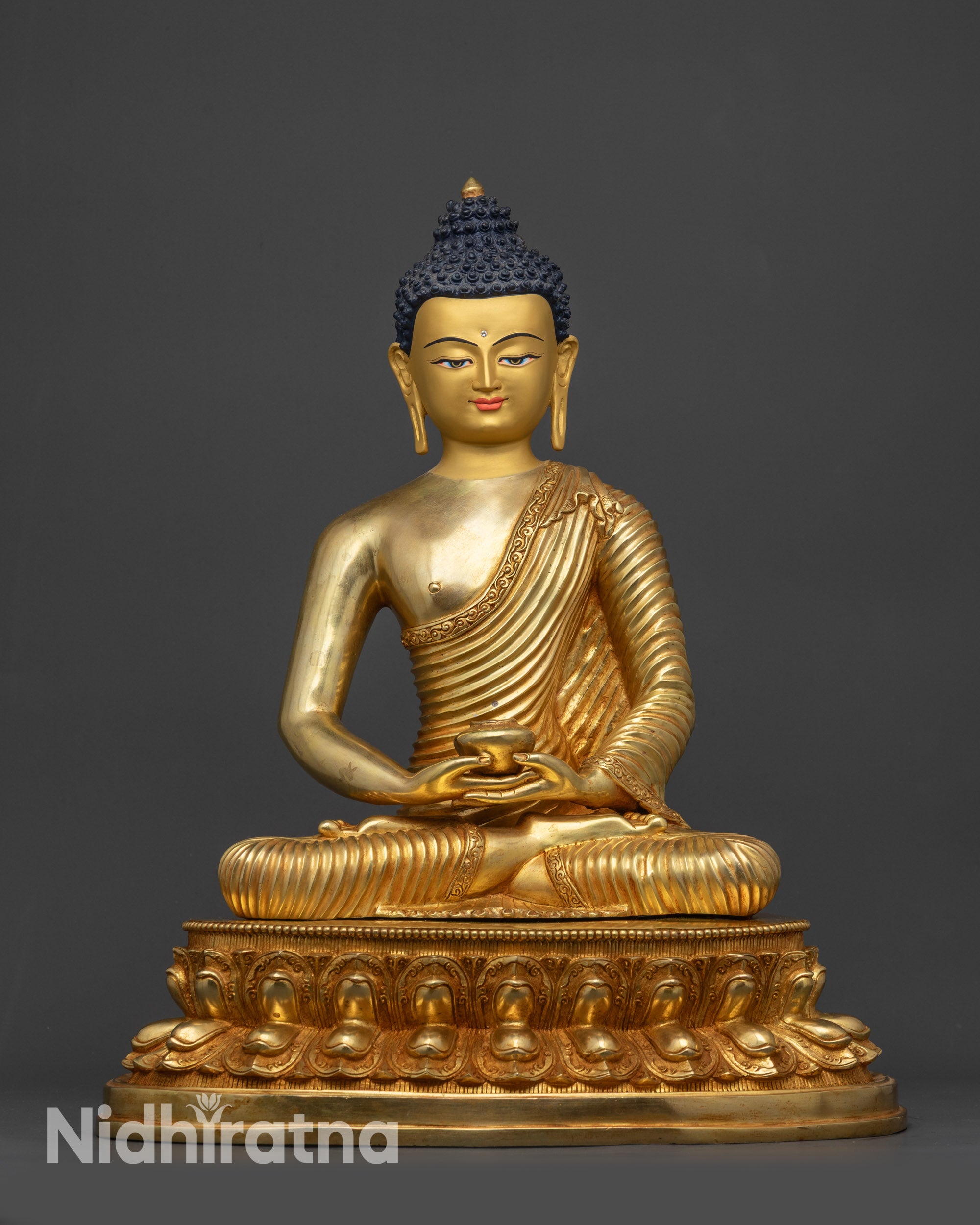 Front view Amitabha Buddha statue with gold-gilded face on lotus seat