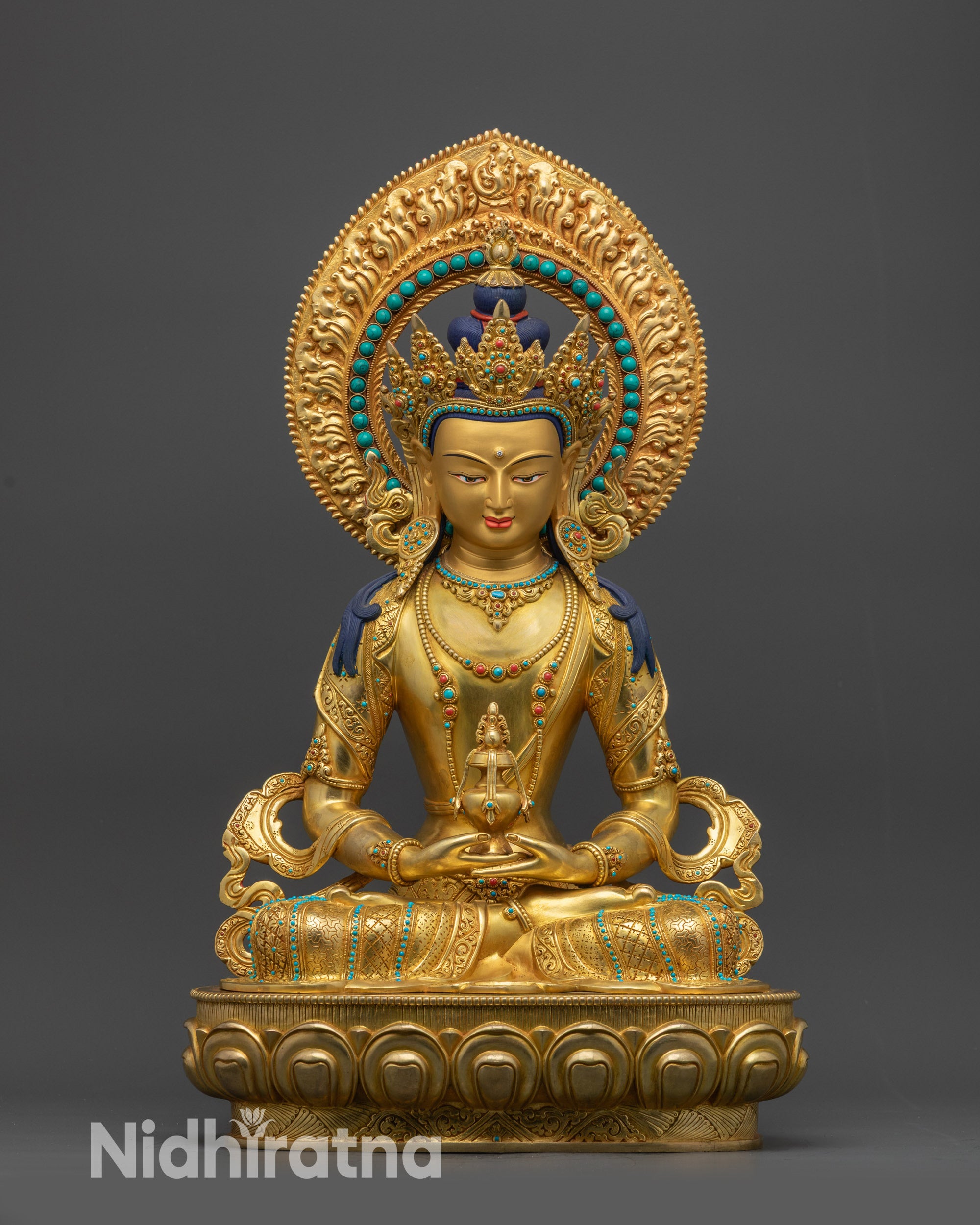 Front view Amitayus Buddha statue on lotus pedestal with gold fire-gilded base