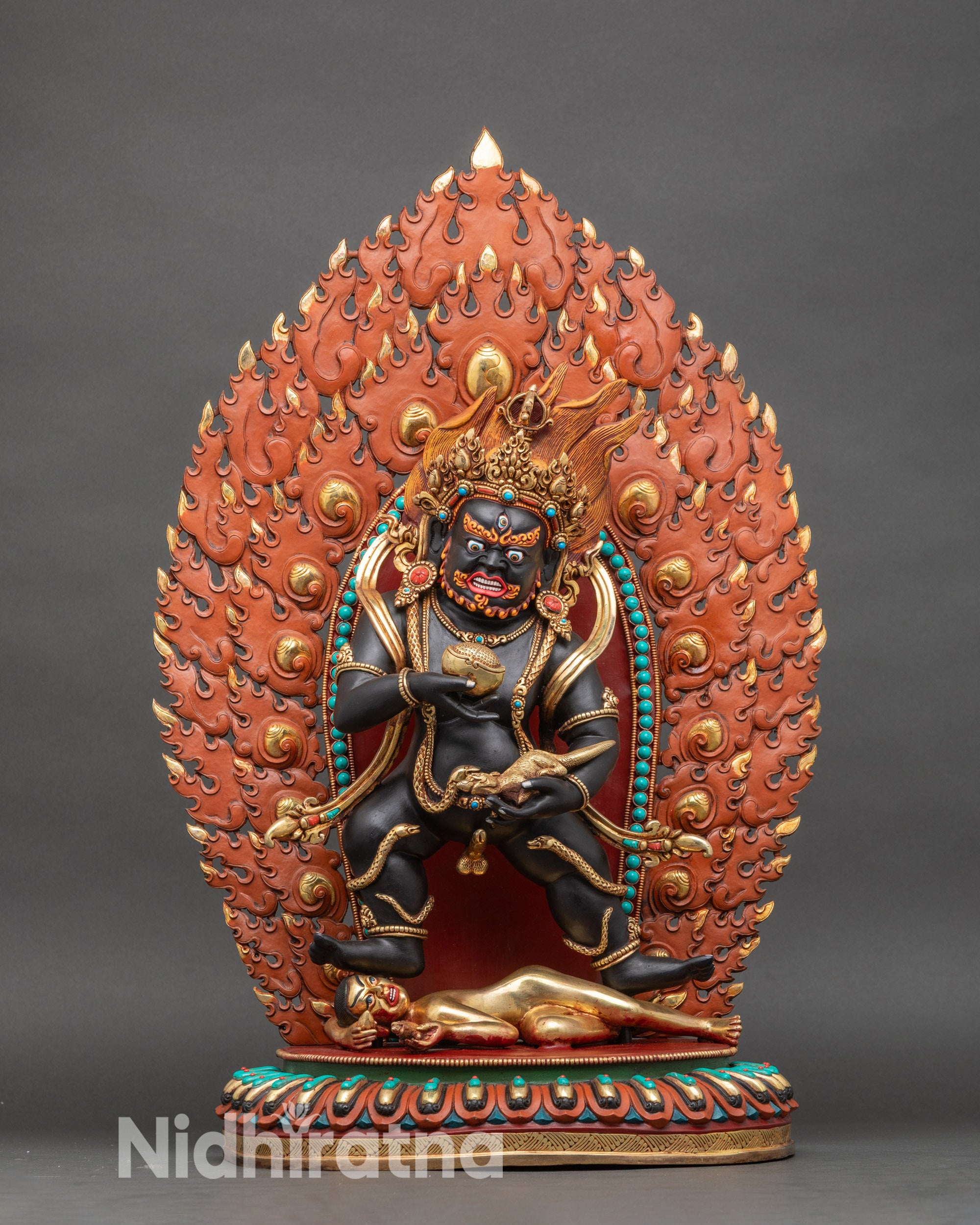 Front view – Black Dzambhala statue in copper with 24k gold gilding, wrathful deity of wealth