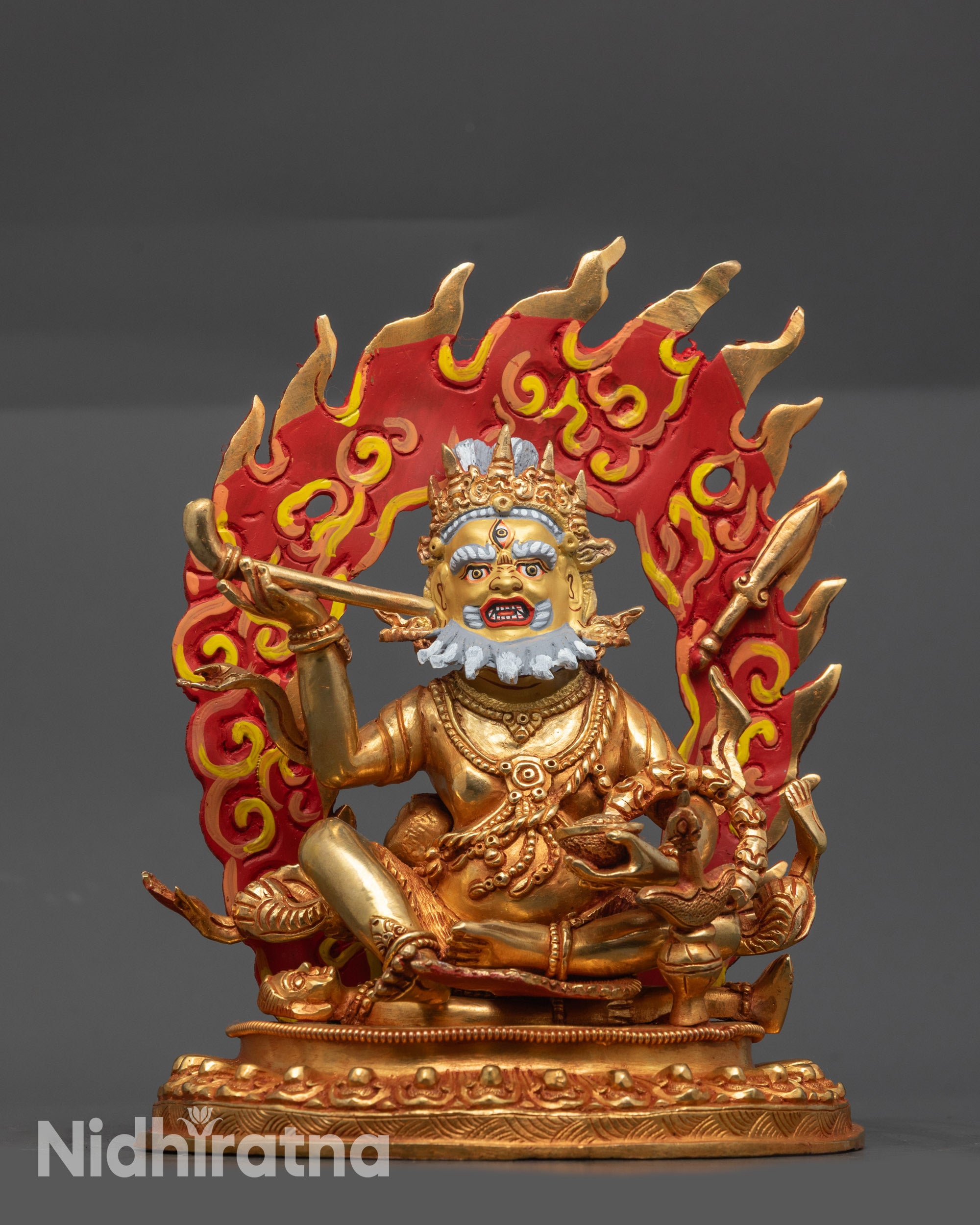 Front view Brahmanrupa Mahakala statue with gold fire-gilded body and blazing halo