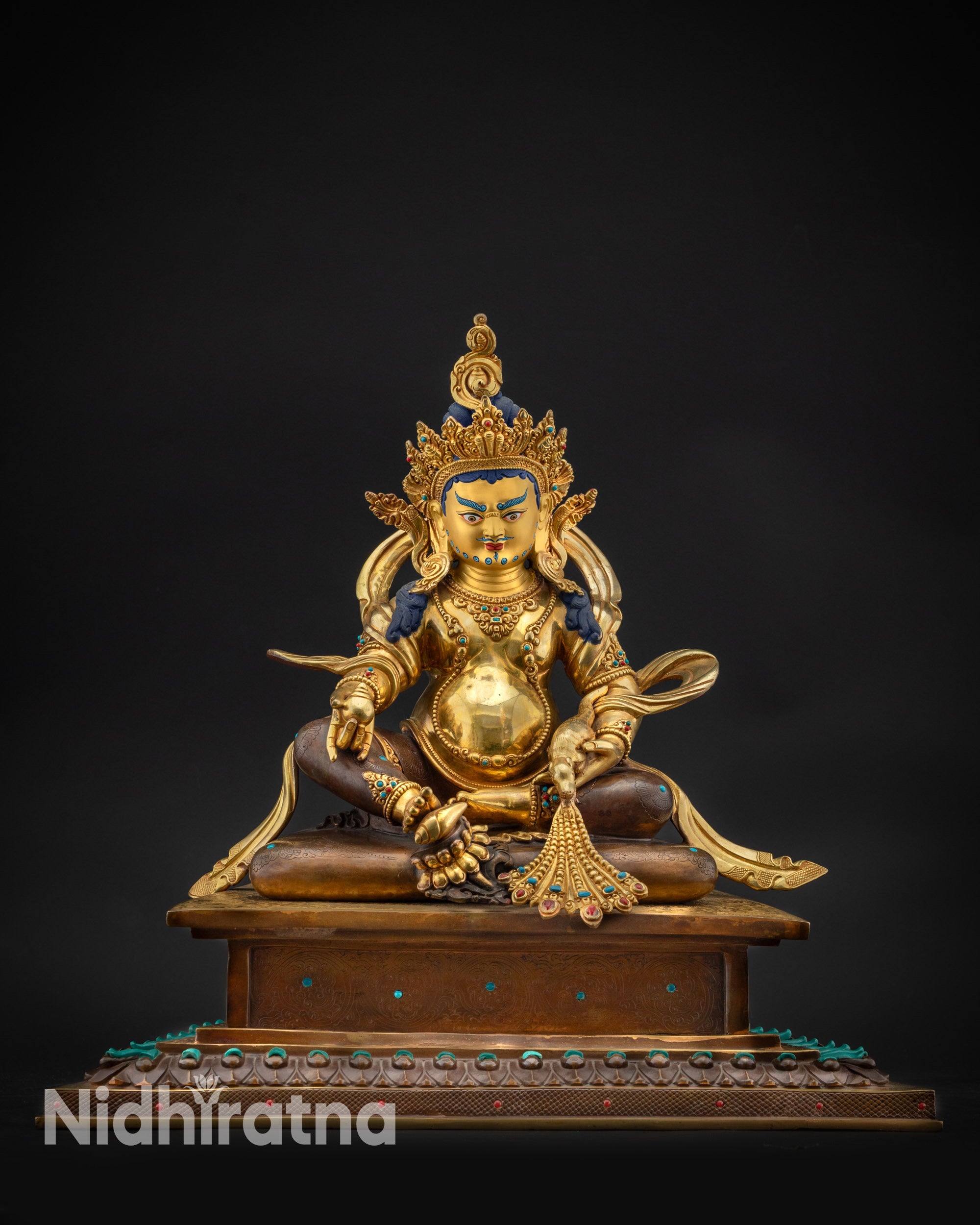 Front view Dzambhala statue on oxidized copper throne adorned with smei-precious stones