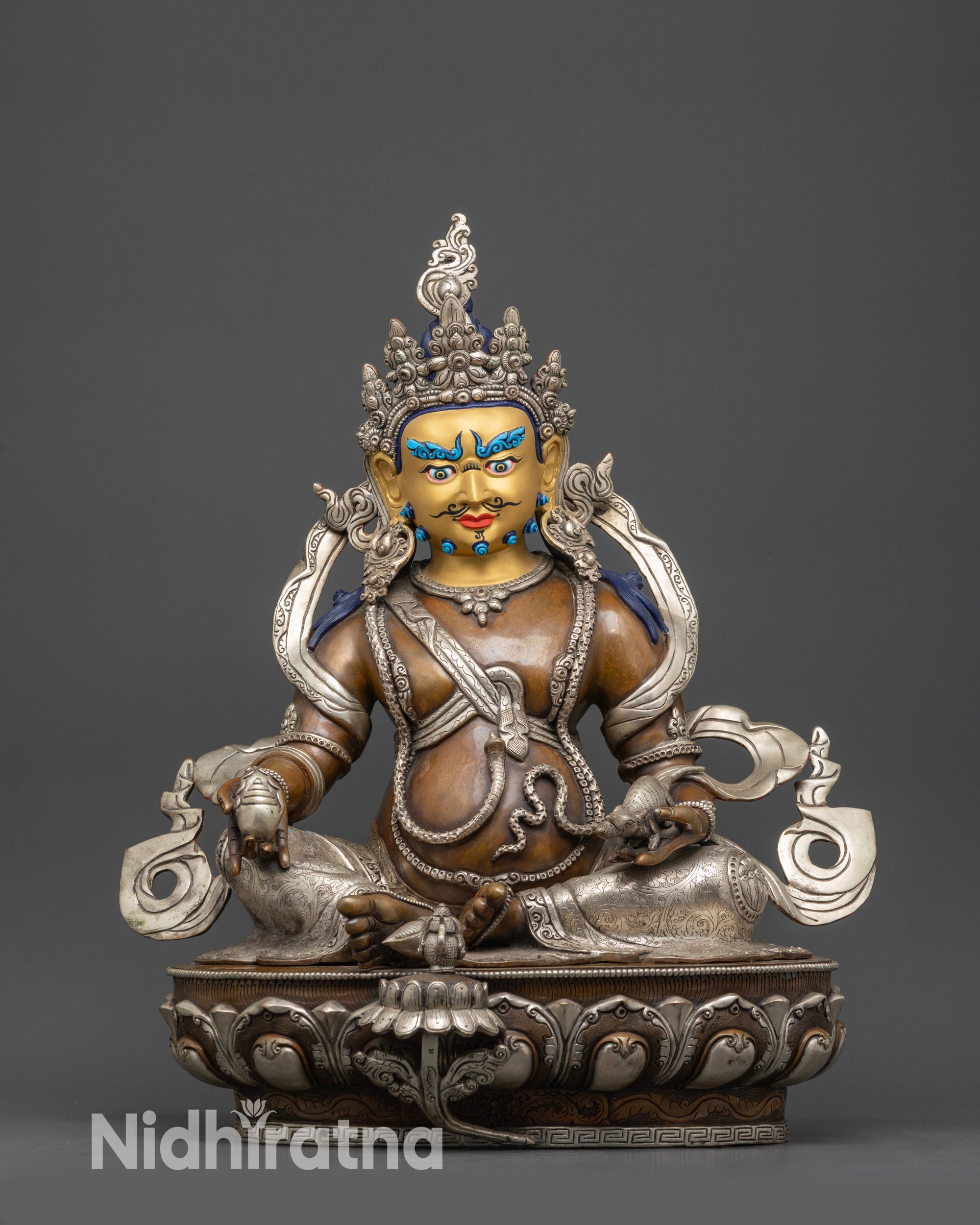 Front view Dzambhala statue with 24K gold-gilded face, lotus seat, citrons, and jewels